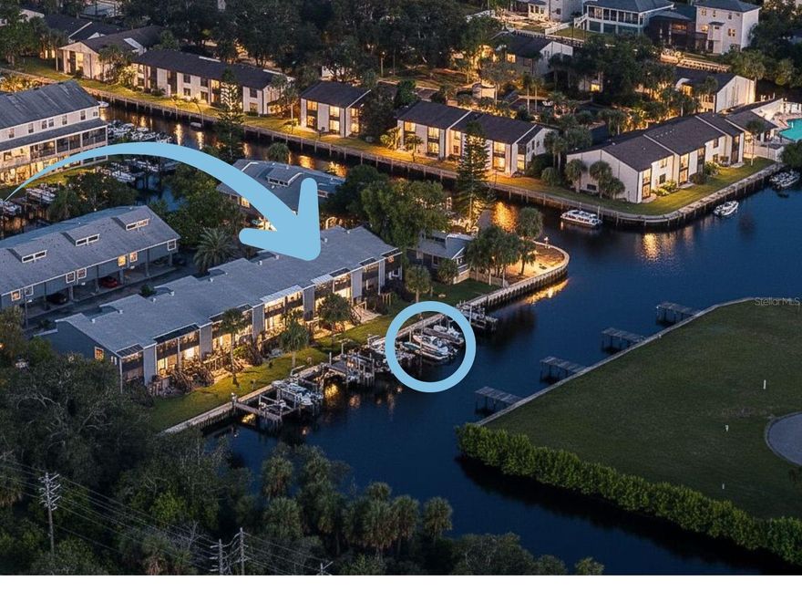 Enjoy unobstructed canal views from this stunning waterfront townhome with one of the most versatile and efficient floorplans you'll find! Community is one of the most financially and physically sound on the Gulf Coast!! Boaters will love the tide-friendly and durable NEWER DockBlocks® floating dock, currently set for a 22-ft center console but fully customizable to meet your specific needs! Store your boat on your OWN deeded dock and save $500+ a month alone plus no lines at the boat ramp to contend with! (Sorry, you'll need to rely on others to capture all that ramp excitement from here on out;)

Inside, bright, modern finishes include vaulted ceilings with wood beams, shiplap accents, recessed and under-cabinet lighting, a rolling kitchen island for any occasion, solid oak stairs, consistent luxury vinyl flooring, and tiled baths. Flexible living spaces feature a loft perfect for an office or guest room. Both balconies feature durable, maintenance free Trex decking! Your outdoor living possibilities are endless here too! On the lower-level patio, imagine unwinding in your private portable hot tub, watching the sun rest over the canal, and enjoy the fruits of your labors without the yard work!!

The home is currently configured for versatility: the Guest Room is being used as the Master Suite with plenty of room for their King bed plus dual nightstands! The "Traditional" Master Suite functions as a large office. Perfect for those who work from home! The upgraded loft doubles as a guest bedroom for this family but could easily be used as an office space as well! The possibilities for furniture configuration in this floorplan are virtually endless!!

Recent upgrades and maintenance provide peace of mind: wind-mitigation study (2023), new roof (2022), new vinyl siding (2021), new seawall (2024), fully funded reserves, new irrigation (2024/2025), and St. Augustine ProVista sod (2024). Additional seller upgrades include a stilted Carrier A/C (2024) with warranty, stackable washer/dryer (2023), water heater (2023), fresh paint, updated vanities, fixtures, skylights, and kitchen hardware.

The HOA covers flood and hurricane insurance, building reserves, landscaping, pest/termite services, premium cable/internet/subscription packages, water/sewer, trash pickup, pool, clubhouse, and building & dock maintenance. Extra flood insurance covering $87,000 of contents/building with a low $200 deductible is paid for and transferable to the buyer through 11/27/2027.

Ideally located for waterfront living and walkable convenience: bikeable to the Pinellas Trail in 3 minutes, a short stroll to the Sponge Docks, parks, boat ramps, beaches, and shopping. Quick access to the Gulf of Mexico (15 minutes) and just 5 minutes from the world-famous Sponge Docks. Move-in ready and customizable to your lifestyle—this coastal-styled townhome offers the ultimate Tarpon Springs waterfront experience. Preferred lender offering exclusive incentives on this property!! Schedule your showing today and let's welcome you HOME tomorrow!!