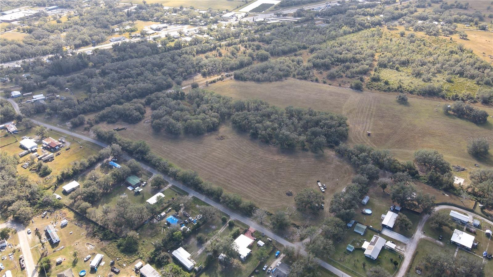 Prime +/- 20-acre light industrial property with Neighborhood Mixed Use (NMU) future land use, offering flexibility for a variety of development opportunities. Strategically positioned just off US-17, this site provides convenient access to major transportation routes, making it ideal for industrial, commercial, or mixed-use projects. The zoning allows for light manufacturing, warehousing, and distribution, while the NMU designation permits potential residential development up to 3.5 dwelling units per acre, supporting a balanced mix of uses. This expansive property presents a rare opportunity in the growing Arcadia market, with excellent potential for investors, developers, or owner-users seeking a well-located and versatile site.
Located on SW Boll Weevil Rd. in Arcadia, FL, this +/- 20-acre parcel sits just off US-17, a major north-south corridor connecting Arcadia to Punta Gorda and other key markets in Southwest Florida. The area is experiencing steady growth, making it an attractive location for industrial and mixed-use development. The property benefits from its proximity to Arcadia’s commercial core, local businesses, and distribution networks, while maintaining accessibility to the region’s expanding workforce. With its strategic location and flexible land use potential, this site is positioned for long-term value and development success.