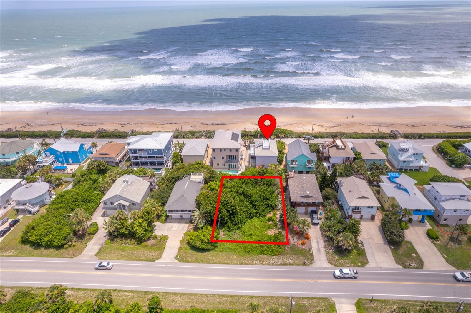 Embrace the allure of coastal living on this extraordinary vacant lot, offering views of the Atlantic Ocean. Imagine waking up to the soothing sound of waves crashing against the shore and basking in the golden hues of sunrise over the horizon. This property resides outside the city limits of New Smyrna, adhering to the building regulations of Volusia County. This translates to fewer restrictions and greater flexibility, allowing you to explore endless possibilities for your new home design. Now is the opportune moment to seize this chance to craft your own coastal haven in one of Florida's most coveted beach destinations. Don't miss out on this extraordinary opportunity to live the beach lifestyle you've always envisioned. Also available for purchase is the adjacent home located at 6368 Turtlemound Rd on a 50x100 lot, with deeded walk over access to the ocean. No Drive Beach!