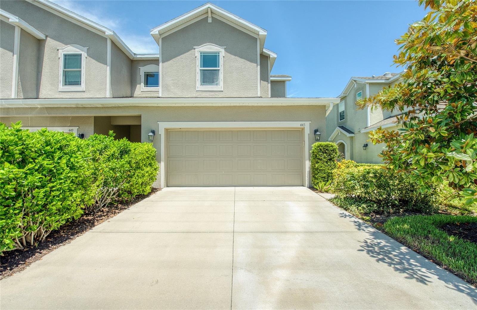 Welcome to 433 Harbor Springs Drive, where modern elegance meets tranquil living in the heart of Palm Harbor’s coveted Harbor Springs community. This exquisitely updated 3-bedroom, 2 1/2-bath townhouse offers a seamless blend of luxury and comfort, perfect for those who appreciate the finer things in life. As you enter, you’ll be captivated by the expansive living room, crown molding, Luxury Vinyl Plank floors, 5" baseboards - where soaring ceilings and an abundance of natural light create an inviting, airy atmosphere. The heart of the home, the eat-in kitchen, is a chef’s paradise—boasting 42" cabinets, gleaming quartz countertops, top-tier stainless steel appliances, and a spacious walk-in pantry. Whether you’re preparing a quick breakfast or hosting a dinner party, this kitchen caters to your every need with style and functionality. Step through sliding glass doors onto the oversized paved screened patio, your personal oasis surrounded by lush landscaping. Privacy prevails. This park-like setting is the ideal backdrop for morning coffee, evening relaxation, or entertaining guests under the Florida skies. The thoughtfully designed first floor with includes a convenient half bath, perfect for guests. Upstairs, the primary bedroom offers a private sanctuary with an en-suite bathroom, creating a retreat where you can unwind after a long day. Two additional bedrooms are generously sized, sharing a well-appointed full bath. The laundry closet is strategically located on the second floor, adding a touch of practicality to your daily routine. The two-car garage provides ample space for your vehicles and additional storage. As part of the Harbor Ridge community, you’ll enjoy access to a sparkling pool just a short walk away, perfect for cooling off on warm Florida days. Beyond the community, the location is unbeatable—just moments from the pristine Gulf beaches, the scenic Pinellas Trail, and a variety of fine dining, shopping, and entertainment options.
