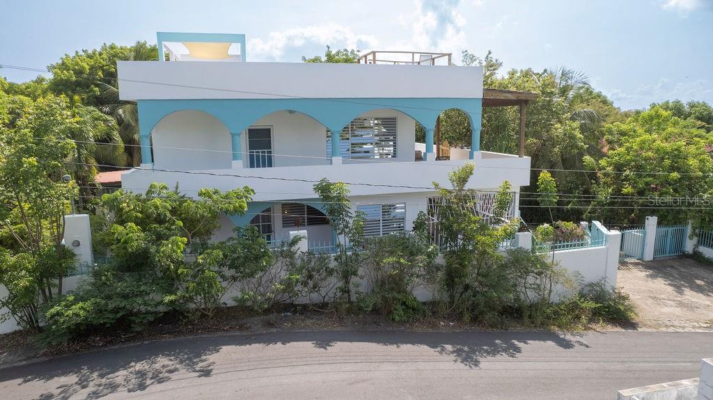 e to Quinta Vagabunda on Vieques Island, Puerto Rico, offering a unique blend of tranquility, views and opportunities. Nestled on one acre of lush tropical gardens, this exquisite property features three separate units, perfect for a large family, investors, or those seeking a private retreat. Quinta pricing is razor focused to get noticed and lead to a quick sale.
Key Features
Three Separate Units: Each unit is a self-contained oasis, complete with its own living area, kitchen, and bedrooms.
Swimming Pool: Relax and unwind in the sparkling pool, surrounded by lush tropical gardens and breathtaking views.
Laundry Room: Conveniently located for easy access, the laundry room is perfect for washing and drying clothes.
Garage: Secure parking for multiple vehicles, keeping your property and valuables safe.
Tropical Gardens: Explore the vibrant gardens, teeming with exotic plants and flowers, creating a serene and peaceful atmosphere. There are multiple Mango trees and a large Avocado
Two-Sided Views: Bask in the stunning views of both the Atlantic and Caribbean seas, a true tropical paradise.
A roof-top=terrace for viewing the many iconic sites on Vieques Island.
Additional Amenities
Private entrance to each unit
Fully equipped kitchens in each unit
Spacious living areas with large windows for natural light
Private balconies and patios for outdoor living
Plenty of storage space throughout the property
Investment Opportunity
This Quinta on Vieques Island presents a unique investment opportunity for those seeking a rental income or a private retreat. With three separate units, the possibilities are endless. Whether you're looking to generate passive income or create a private oasis, this property is sure to exceed your expectations.