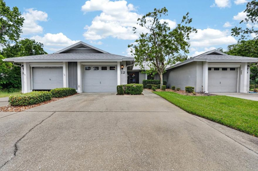 Welcome home to this beautifully designed 2-bedroom villa offering comfort, functionality, and easy Florida living! The spacious great room and dining room combination is enhanced by soaring vaulted ceilings, creating an open, airy atmosphere perfect for entertaining or everyday relaxation. Natural light fills the home, while skylights in the kitchen and dining area add warmth and brightness throughout the main living spaces. The oversized kitchen features an abundance of cabinet storage and expansive countertop space, along with a charming breakfast nook ideal for morning coffee or casual dining. A convenient pass-through from the kitchen offers the possibility for additional seating, making gatherings effortless and keeping the space connected. The private primary suite provides a peaceful retreat with a large walk-in closet and comfortable layout. Sliding glass doors from the great room open to a spacious covered and screened patio, creating the perfect indoor-outdoor flow for relaxing or entertaining year-round. The backyard offers a nice outdoor setting with plenty of space to enjoy gardening, pets, or simply soaking in the Florida sunshine. With its thoughtful floor plan, bright open spaces, vaulted ceilings, skylights, and inviting outdoor living area, this villa is ready to welcome you home!