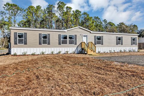 Photo of 16879 SW 42nd Loop, Ocala, FL 34481 (MLS # OM717847)