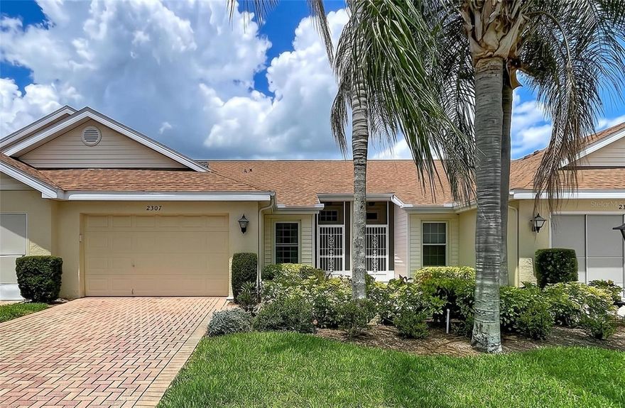 Welcome to peaceful waterfront living in the highly sought after Kings Point community of Sun City Center, where maintenance-free living, resort-style amenities, and golf cart accessibility create the perfect over 55 Florida lifestyle. Perfectly positioned on a quiet cul-de-sac with tranquil pond and conservation views, this beautifully updated Concord floor plan offers the rare combination of privacy, natural beauty, and modern interior updates. From the moment you enter, you’ll notice the bright, open feel created by vaulted ceilings, abundant natural light, and expansive rear windows that showcase the serene setting beyond. This home underwent a complete renovation in 2025, featuring luxury vinyl plank flooring throughout, fresh Sherwin Williams interior paint, scraped and refinished ceilings, updated ceiling fans and light fixtures, and custom shiplap accent details that add warmth and character to the home. The kitchen has been tastefully updated with quartz countertops, tile backsplash, undermount sink, stainless steel appliances (counter depth refrigerator), sliders in lower cabinets for easy access, and breakfast bar seating that opens seamlessly to the main living area - ideal for both everyday living and entertaining. One of the home’s standout features is the spacious Florida room, where panoramic water and conservation views create a peaceful backdrop year-round. Whether enjoying morning coffee while watching the sunrise and wildlife over the water or unwinding at the end of the day, this space truly captures the beauty of Florida living. The split-bedroom floor plan offers privacy for owners and guests alike. The spacious primary suite accommodates king-size furniture with ease and features a walk-in closet along with an updated en-suite bathroom offering stone countertops, newer vanity, and walk-in shower with glass enclosure. The guest bathroom has also been updated with a new vanity and tub/shower surround. Additional highlights include inside laundry, updated plumbing and electrical, an extended paved driveway, covered breezeway entry, and a 1.5 car garage with room for both a vehicle and golf cart. This home comes with a 13 month home warranty for buyer’s Peace of Mind and to help make transitioning easier! Kings Point residents enjoy access to indoor and outdoor heated pools, pickleball, fitness centers, cafés, restaurants, salon services, clubs, social activities, security, and more. Monthly fees include roof repair/replacement, exterior painting, cable, internet, exterior insurance, grounds maintenance, water, sewer, trash, pest control, and more. Conveniently located near Tampa International Airport, Sarasota, Gulf beaches, and Ellenton Premium Outlets. Beautifully updated and surrounded by nature, this is the kind of peaceful Florida retreat buyers dream about. Room sizes are approximate – Buyer must verify.  PLEASE CLICK VIRTUAL TOUR LINK.