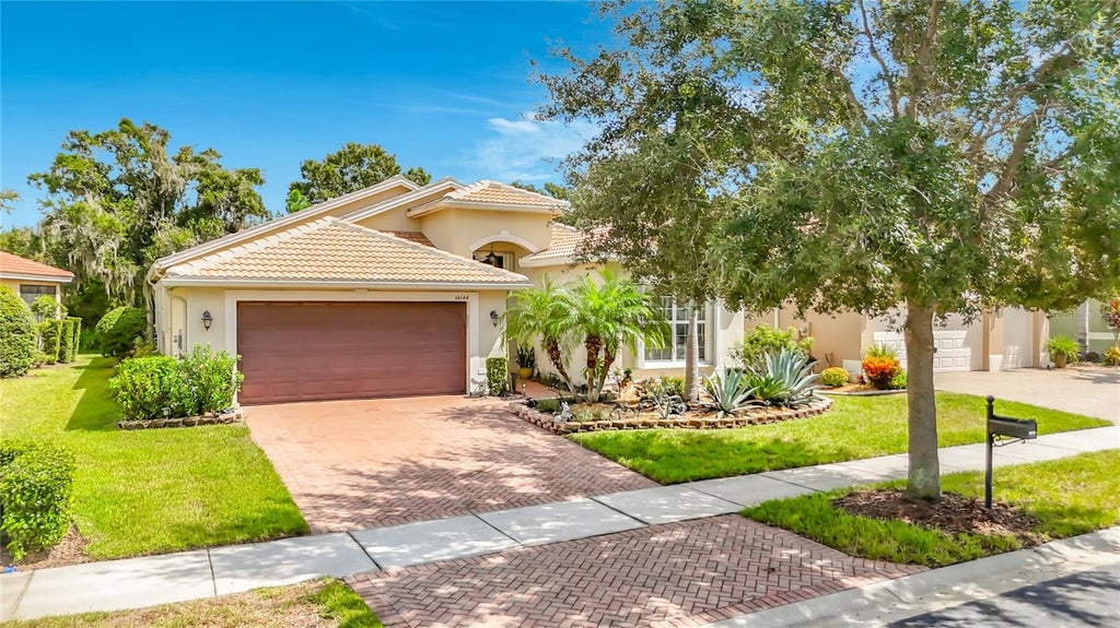 Photo of 16144 Coquina Bay Lane, Wimauma, FL 33598 (MLS # O6445542)