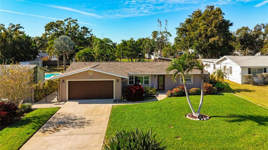Enjoy your private Florida paradise with all of the conveniences nearby. The large backyard with pool and covered gazebo are enough to allow you to escape into the Florida sun. The deck pavers were recently reset sealed, the backyard was leveled, raised in elevation and resodded. A new 4inch pool drain was put in along with gutters around the house. Yard is irrigated via a well that has had the well pump recently replaced. All interior freshly painted. Both bathrooms updated/remodeled. Enjoy the large family room/Florida room. It has hurricane windows and steps right outside onto the pool deck. No carpet, all tile and vinyl throughout the home. Roof 2017, AC2017, WH 2024, Garage opener 2025, sprinkler well pump 2025. This home is ready for you to move right in and start enjoying your daily swims and Florida living! Close to shopping, restaurants, and beaches.