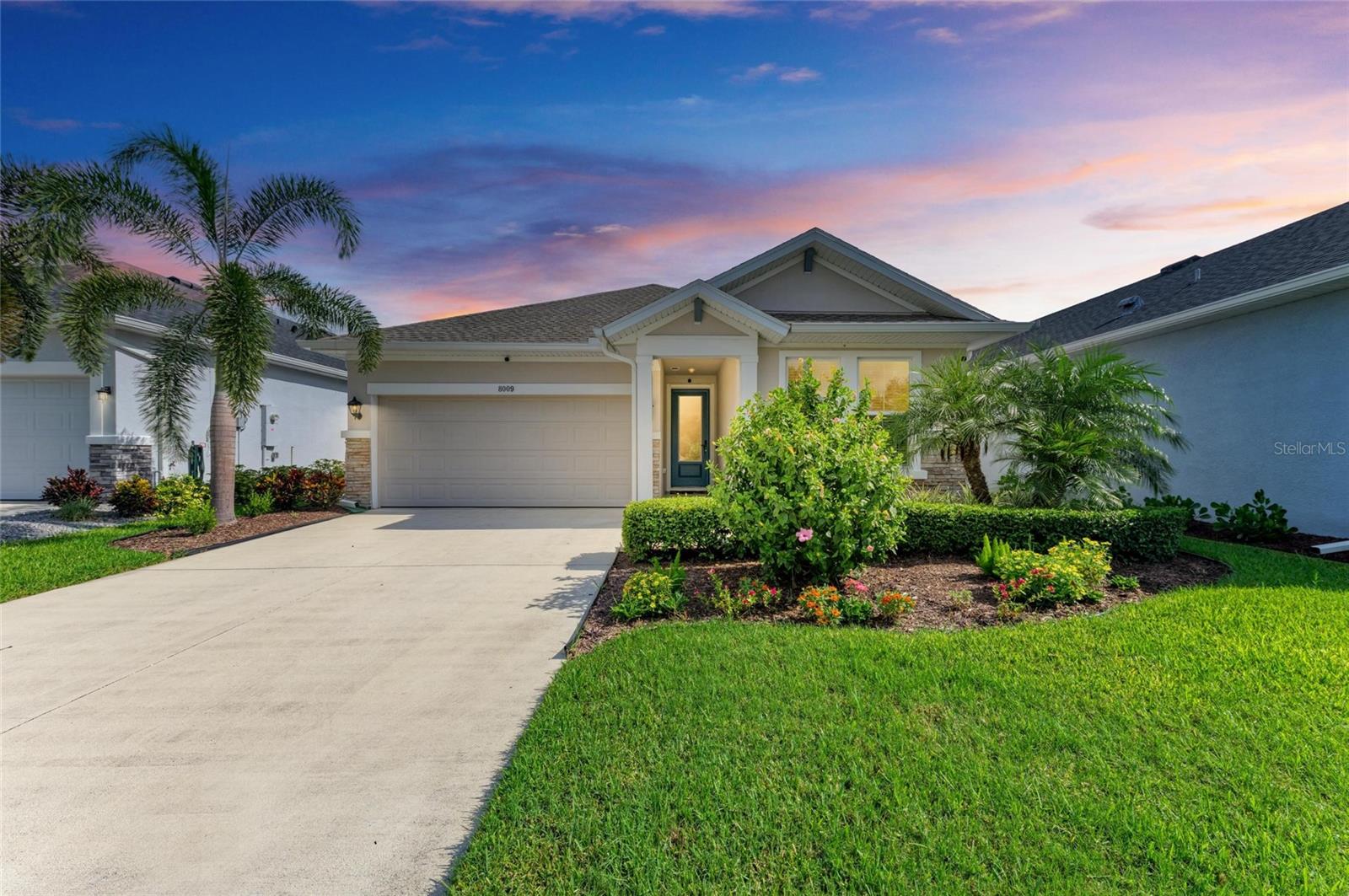 Welcome to the Ensenada by David Weekley Homes – A Beautifully Crafted One-Story Home in North River Ranch. This impeccably designed one-story Ensenada floor plan offers 2,631 square feet under roof and blends timeless style with modern comfort. With 3 bedrooms, 2 bathrooms, a den/office, and a 2-car garage, this home is ideal for both everyday living and entertaining. Nestled on a peaceful cul-de-sac with no front or rear neighbors, the home enjoys serene water views from the owner’s suite, kitchen, dining, and living rooms, creating a calm and scenic backdrop throughout the main living areas. Step into a welcoming entryway featuring custom board and batten millwork with a picture rail, leading into the expansive open-concept living space. The gourmet kitchen showcases granite countertops, a large island with bar seating for four, a corner walk-in pantry, and stylish finishes—a true culinary centerpiece. The spacious living and dining rooms are bathed in natural light and offer beautiful views of the water, making this home a peaceful retreat inside and out. Your owner’s suite includes water-facing windows, a luxurious en suite bathroom with an extended slip-resistant shower, and a walk-in closet outfitted with ClosetMaid ShelfTrack shelving. A pass-through door provides direct access to the laundry room for added convenience.
Two additional bedrooms offer comfort and privacy, with plush carpet and ample storage. The guest bathroom features a tub/shower combo and ceramic tile flooring. The den/home office is light-filled and versatile—ideal for a creative studio, workspace, or playroom. Additional features include: Screened and extended lanai with blue epoxy flooring, matching epoxy floors in the 2-car garage, electric attic hoist for easy storage access, attic flooring installed with plywood for additional storage capacity, accent millwork wall in the dining area, and rear north-facing orientation for optimal natural light. Community Amenities at North River Ranch, Three resort-style pools, including the newly completed Camp Creek plunge pool, fully equipped fitness center, community rooms, and event spaces, expansive parks, playgrounds, greenways, trails, and pet-friendly dog park. Experience water views, luxury finishes, and community living all in one place. Welcome home to the Ensenada—schedule your private tour today!