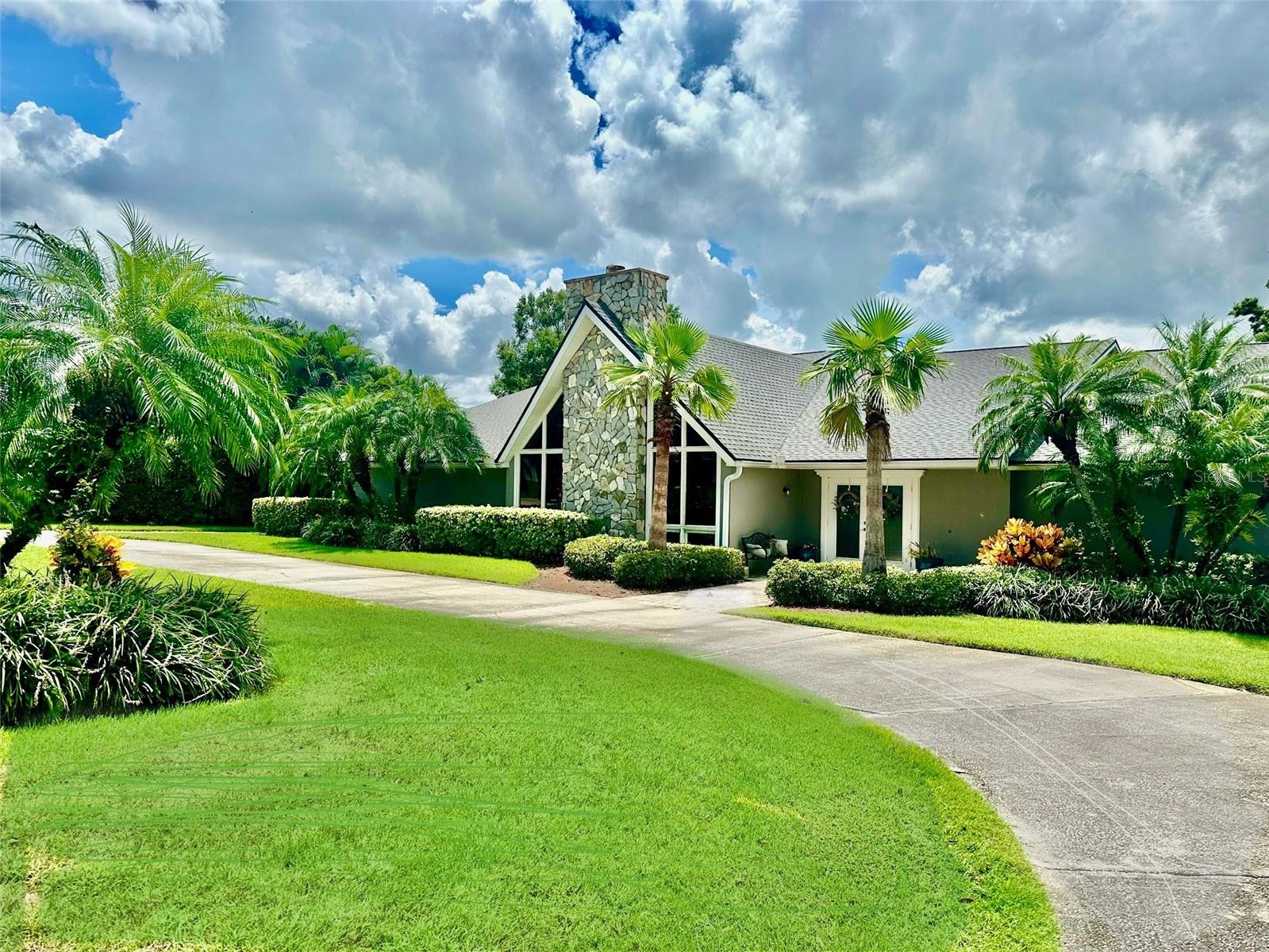 This unique stunning 5/5, 6600 square feet of living space, true lakefront, pool home offers a luxurious and convenient lifestyle with a host of desirable features. The two-story home has the majority of living on the first floor and the second floor is a basement level. It is situated in a unique cul-de-sac neighborhood, one entrance and one exit neighborhood, providing a sense of exclusivity and privacy. Boasting a 120 foot frontage of lakefront on highly desirable Lake Arietta, the property offering breathtaking views and the added benefit of a private dock with a boat lift. The house is thoughtfully designed with a split bedroom plan, ensuring privacy and comfort. The living spaces include both a Living Room and a Family Room area, providing versatile options for relaxation and entertainment. Off the Family Room and eat in kitchen area is a large deck with a TV to entertain and also enjoy the lake, especially gorgeous sunsets. The property features an electric heated pool, making it an ideal place for year-round enjoyment and relaxation, and an amazing entertaining area. One of the standout features is the presence of two full kitchens, allowing for a high level of convenience and functionality. The unique setup provides the possibility of creating a mother-in-law suite with its own entry and kitchen located off the pool area, adding flexibility to the living arrangements. For those who enjoy outdoor activities, the property is perfect for bringing your toys, as there is no homeowners association (HOA) restricting your use of the space. Additionally, the central location near I-4, Polk Parkway, Hwy 33, and positioned between Tampa and Orlando, offers easy access to major highways and attractions. Professionally decorated, this home exudes upscale living, combining elegance with practical features. Whether you're relaxing by the pool, enjoying the lake views, or entertaining guests, this property promises a lifestyle of comfort and luxury. It truly encapsulates the best of both indoor and outdoor living, making it a dream home for those seeking a unique and upscale living experience in Polk County.