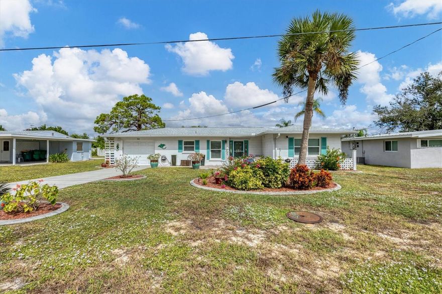 Charming turnkey Bungalow located 1.8 miles from Englewood beach. The home features two spacious bedrooms, two bathrooms, one car garage and large enclosed Florida Room.  This property is a perfect second home, rental investment property; or make it your permanent residence!  If you are looking for Florida living close to the BEACHES, this home is for you!  UPDATED kitchen and bathrooms as well as beautifully maintained Terrazzo flooring in the majority of the home, complimented with lovely blending ceramic tile in the Florida room which gives this home a cohesive flow and provides cozy comfort. The dining room boasts a built-in cabinet and shelf for easy entertaining and storage.  NO HOA! NO CDD!  Recent updates include a new roof (2023),  newer HVAC (2019) and electric panel (2021).  IMPACT WINDOWS for peace of mind and energy savings.  Bring your clothes and yourself (beach chairs are already included!) and enjoy the beautiful Florida weather with plenty of outdoor activities.  Turnkey furnished (minus a few person items to be removed by the owner), you can move right!  Property includes deeded boat lot on Godfrey Creek with access to Lemon Bay and the Gulf of America.
