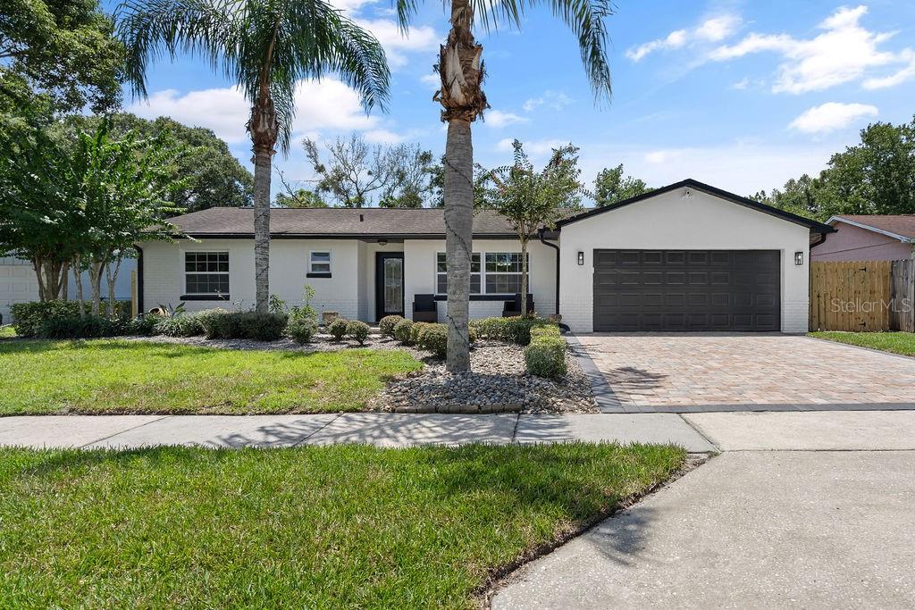 Expect to be impressed with this immaculate and move-in ready home in the well-
established Riverwood community. It starts with great curb appeal - brand new sod & attractive landscaping, paver driveway and quaint front porch, new exterior light fixtures
and a custom, etched glass front door. Step inside to an interior which reflects current
design trends and exudes a bright and inviting living space. Quality improvements
include: (1) beautifully updated baths, (2) Kitchen updates, including refurbished
cabinets, granite counters and striking tile backsplash, (3) fresh interior/exterior paint,
(4) removal of popcorn ceiling (a plus!), and (5) double paned windows. Layout features
open common living space running from the front to the back and a split bedroom plan.
Kitchen boasts an abundance of raised panel cabinetry, breakfast bar, a convenient
pass-through window to the family room, and adjacent dining space that can seat a
crowd. All appliances included (kitchen, washer/dryer). Spacious family room makes a
great gathering space and provides direct access to the backyard lanai. The family room can be used as either an Office/Den or another living room space/bonus room, or both! It's large enough to use as you see fit. Primary suite is
in the back off the common living space – ideal for privacy. Here you’ll enjoy a generous
sized bedroom, ensuite bath with shower (rain shower head!) and walk-in closet with
custom shelving. Secondary bedrooms and bath are tucked off the home’s hallway near
the front entry. Other notable interior features: updated ductwork throughout; the roof
was replaced in 2014. Another thing to love about this home is all that you have out
back – expansive paver stone screened lanai (new screens) along with a large, open
paver patio. The backyard has a new irrigation system and is dotted with fresh
landscaping. Fencing gives you the privacy you’d want as you enjoy your fun in the sun.
Ask your agent to see the list that provides all the details reflecting the seller’s good
care and updates to this home. Great location – quiet neighborhood with no HOA! Five
minutes to your Publix, 10 minutes to the Waterford Lakes Shopping Center and less
than 2 miles to SR 408 and SR 417 giving you easy access to all of Central Florida.
You’ll love living here. Come see all that this special home has to offer.