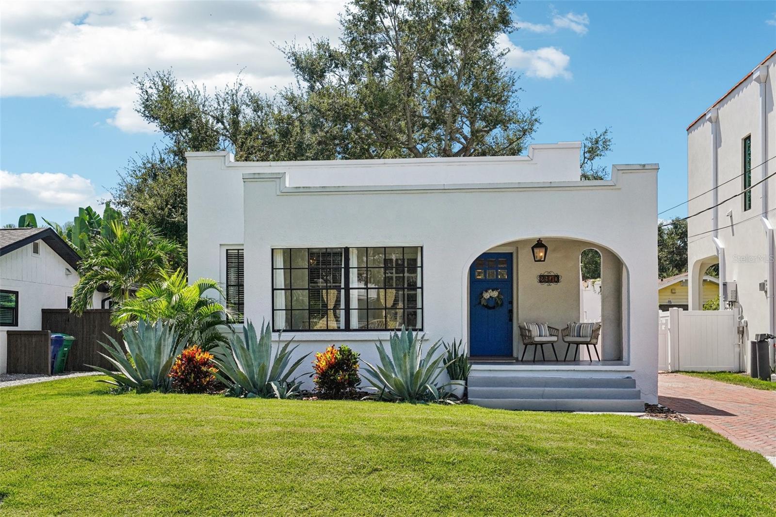 Welcome to this absolute gem—an enchanting Spanish Mediterranean historic home nestled in the heart of Palma Ceia, just blocks from iconic Bayshore Boulevard and within the coveted Plant School District. This beautifully maintained property offers a main residence plus a detached casita perfect for guests, extended family, private home office, or additional living space! Step inside from the covered front patio to find timeless charm with original hardwood flooring, abundant natural light, and thoughtful updates throughout. The inviting living room showcases a decorative fireplace as its focal point, while just off to the side, a cozy, light-filled sunroom provides the perfect spot for morning coffee or quiet reading. The kitchen features stainless steel appliances, including a GE gas range with a sleek range hood (2024), making it a delight for any home chef. A BRAND NEW AC UNIT (2024), Newer Water Heater (2023), and UPDATED PLUMBING (2024) extending all the way to the street provides peace of mind for years to come. Outdoors, discover your own private sanctuary. The backyard is a true retreat, with significant investment poured into its exquisite design boasting a soothing waterfall, artificial turf, lush mature trees and landscaping that create a serene setting for relaxation or entertaining. Additional highlights include a gated brick driveway, oversized storage shed, PVC fencing for full privacy, and a perfect blend of historic character with modern convenience. This is an extremely rare opportunity to own a piece of South Tampa’s prime real estate—where historic charm meets modern living just steps from the water, dining, and shopping. You will absolutely fall in love with this home and the lifestyle it offers in one of Tampa’s most cherished neighborhoods. Book your showing today!