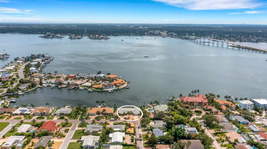 Welcome to 1903 Bayshore Drive, a rare and unparalleled opportunity to own a spectacular waterfront property in the heart of Belleair Beach. This unique offering features a 4-bedroom, 4-bathroom home spanning 2,830 square feet, perfectly positioned on a generous 0.32-acre lot with 180 degrees of breathtaking open bay views and 130 feet of water frontage. The property is being sold as a knockdown, paving the way for you to create your dream waterfront retreat.

Nestled on the prestigious Belleair Beach Island, this property boasts direct access to the serene and stunning waters of Clearwater Harbor. Imagine waking up to panoramic views of the bay, where gentle waves and vibrant sunsets create an idyllic backdrop for everyday living. Belleair Beach is renowned for its tranquil ambiance, offering a perfect blend of luxury and leisure. Just a 5-minute walk out of your front door are the white sand beaches of the Gulf of Mexico. This enables the new owners a rare opportunity to enjoy the boating/fishing life in your backyard, while also providing tranquility and enjoyment for frequent beachgoers. The community is a hidden gem, providing residents with pristine, uncrowded beaches, lush parks, and a welcoming neighborhood atmosphere. Whether you’re a boating enthusiast or simply enjoy waterfront living, this is the location for you!

The waters surrounding Belleair Beach are teeming with marine life, including playful dolphins that frequently grace the shoreline. Enjoy daily sightings of these magnificent creatures from your future home, adding a touch of magic to your coastal living experience. Just a short drive away, you’ll find the vibrant city of Clearwater, known for its award-winning beaches, eclectic dining, and bustling nightlife. Clearwater Harbor serves as the perfect playground for those who love the water, offering endless opportunities for paddleboarding, kayaking, and waterfront dining.

With its prime location and expansive lot, 1903 Bayshore Drive is the perfect canvas for a custom-built estate that embodies your vision of luxury waterfront living. Envision a contemporary masterpiece with sweeping views, an infinity pool, and all the modern amenities you desire. Properties like this are a once-in-a-lifetime find. Don’t miss the chance to secure your piece of paradise in Belleair Beach, where every day feels like a vacation. This is truly Endless Summer Living!! SELLER WILL ENTERTAIN PURCHASING A RATE BUY-DOWN.