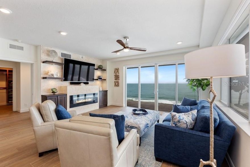 Summon your semi-private elevator that opens directly into your home in a seven story Luxury Boutique condominium that is located on the no drive on beach in Daytona Beach Shores. With over 2600 sq ft of living area and 3 bedroom and 3 baths, this residence has been totally updated. The designer kitchen has been re-designed to feature a massive island with seating for 6, all new appliances, 149 bottle Dual Zone Wine Cooler, massive pantry, and convection microwave drawer, plus more. All the flooring through out has been upgraded to porcelain wood wide plank tile. Enjoy the Master bath that was re configured to feature free standing luxury tub and separate walkin shower stall with designer select tile. Coquina feature wall with Electric Fireplace enhances the cozieness of the designer inspired great room. Enjoy the sunrise, ocean beach front panorama from the oversized patio and retreat to the media room (man-cave) to witness the terrific sunsets and spectacular views of intracoastal waterway While watching your favorite sporting event or movie. TV’s in Livingroom and Media Room do not Convey. Chandelier in dining room and elevator foyer do not convey. Video tour: https://youtu.be/mUHUVX2tJsA ;Water: City