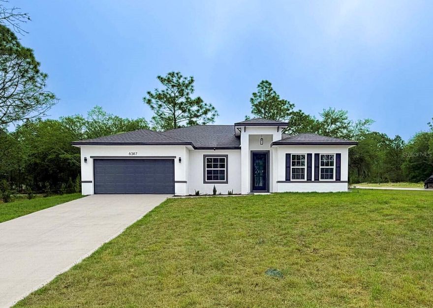 Brand-New Home, Move-in Ready in Citrus Springs – Modern Design, Spacious Living & Peaceful Surroundings. Offering 1,774 sqft of climate-controlled living space and a total construction area of 2,213 sqft. Discover this beautifully built 4-bedroom, 2-bathroom single-family home located in the thriving and tranquil community of Citrus Springs, FL. Thoughtfully designed with both comfort and functionality in mind, this gorgeous residence offers everything you need for modern Florida living. Step inside to an open-concept floor plan filled with natural light and clean architectural lines. The heart of the home is the stylish kitchen, featuring quartz countertops, a center island with a built-in sink and a waterfall side, light-toned cabinets, stainless steel appliances, and a generous workspace, ideal for home cooking or entertaining guests. The kitchen flows seamlessly into a spacious living and dining area, creating a welcoming space for daily living and family gatherings. The split-bedroom layout ensures privacy, with the primary suite offering a large walk-in closet and a beautifully appointed ensuite bathroom. All bedrooms are generously sized and include ample closet space. Durable and attractive vinyl wood plank flooring runs throughout the home, making upkeep simple and providing a clean, contemporary look. Additional highlights include a dedicated laundry room, a 2-car garage with a painted floor, a covered front entry, floor-to-ceiling tiled showers, matte black fixtures, and lighting. The property sits on an oversized lot, offering a spacious backyard with plenty of potential for outdoor living, gardening, or future additions. Located just minutes from shopping — including Publix, Walmart, Target, ALDI, Starbucks, parks, schools, springs, boating, horse riding, a golf course, and the Withlacoochee State Trail. Citrus Springs is known for its quiet charm, natural beauty, and easy access to Florida's Nature Coast. Whether you're a first-time buyer, a growing family, or looking for a wise investment, this home checks all the boxes. Don't miss your opportunity—schedule your private tour today!