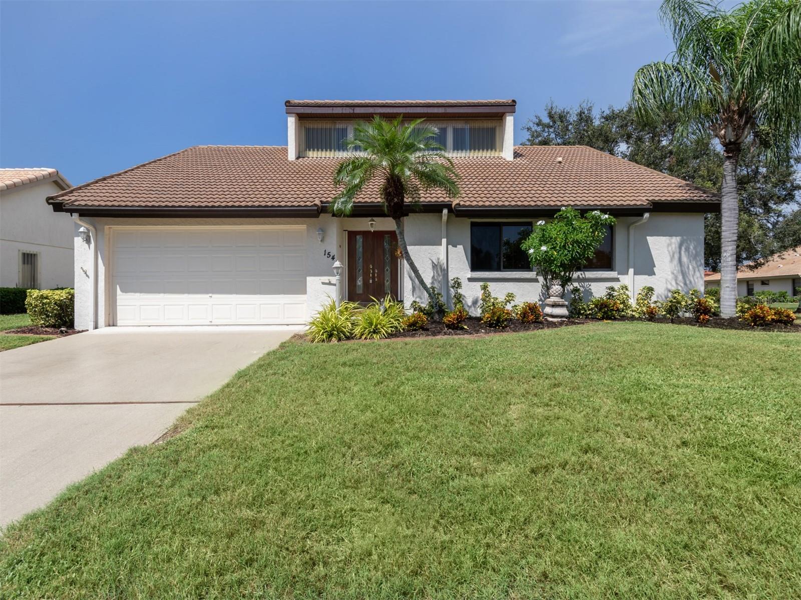 Incredible opportunity for this fabulous furnished three-bedroom, two-bath, two-car garage home in The Inlets in Nokomis, just one mile to Nokomis Beach! Volume ceilings with lots of light draw you in upon entry into this spacious open floor plan. Great room lives large and is focal point of the home, with dramatic ceilings allowing for easy living and access to all other rooms in the home. Conversation area and formal dining space is connected which allows for ample space for entertaining or large gatherings. Generous primary bedroom creates a peaceful resting space and flows into the updated primary bath with two separate vanities, large walk-in shower, separate water closet and large walk-in closet. The guest bedrooms are on opposite sides of the home with adjacent guest bath, creating additional privacy and space for your guests. The kitchen has ample cabinet space for great storage featuring light cabinets, Corian countertops and updated backsplash. Generous dining space off the kitchen has gorgeous views of the huge lanai, outdoor patio and garden beyond. A wonderful home in a fantastic community. Features include new garage door 2025, air conditioning 2023, tile roof 2013 and re-piped 2010. The Inlets is a gated, amenity-rich community featuring a large community pool, spa, tennis courts, pickleball courts, fitness room, bocce and more. Please schedule your appointment today as this one won’t last.