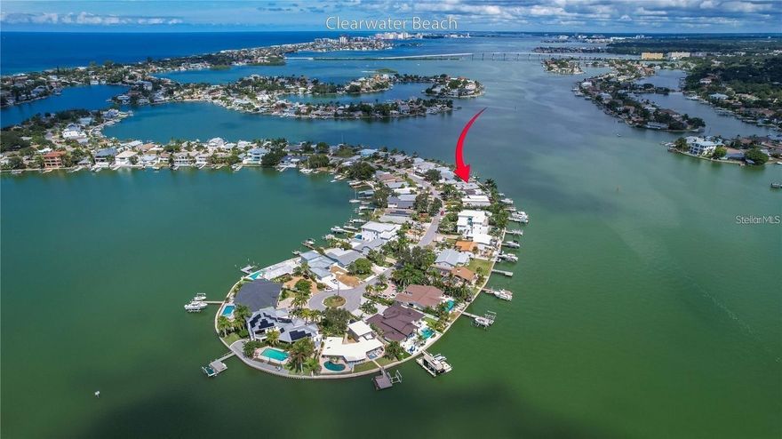 Oversized WATERFRONT lot. Indian Rocks Beach Lot 21 and 22 on Direct Intracoastal. BUILD YOUR DREAM HOME. Over 100 foot of New Seawall in 2021. Has New Dock with 2 Lifts, 10,000 lb lift for your Boat and 6,000 lb lift for Wave runner.   Plummed for water and electric. 2 car Garage on property can be incorporated into your building plans or removed. Encompasses both double driveways.