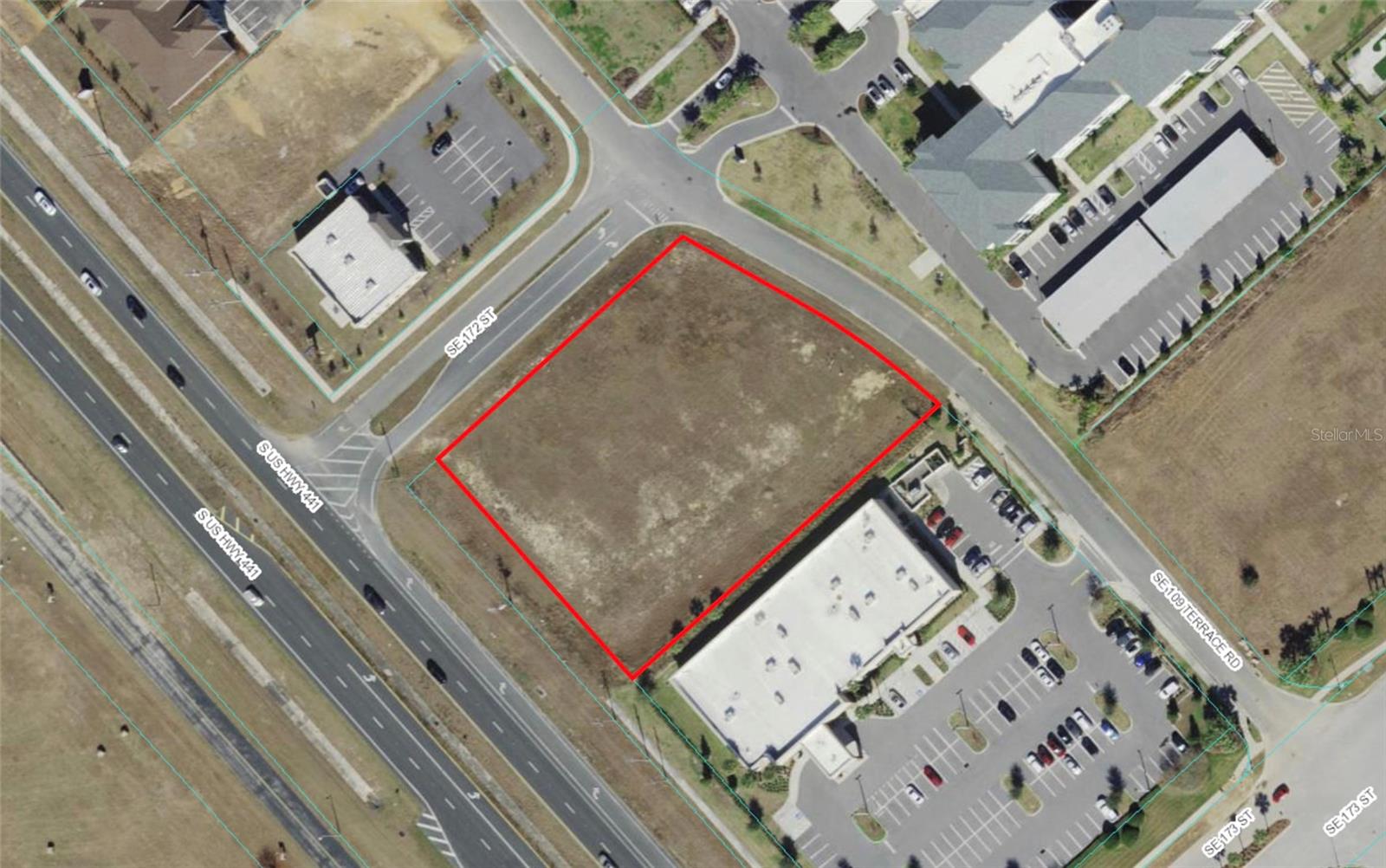 Corner lot on top of the hill overlooking The Villages. Commercial lot priced to sell. Property is deed restricted to a bank or lending institution only. Off Site Retention.