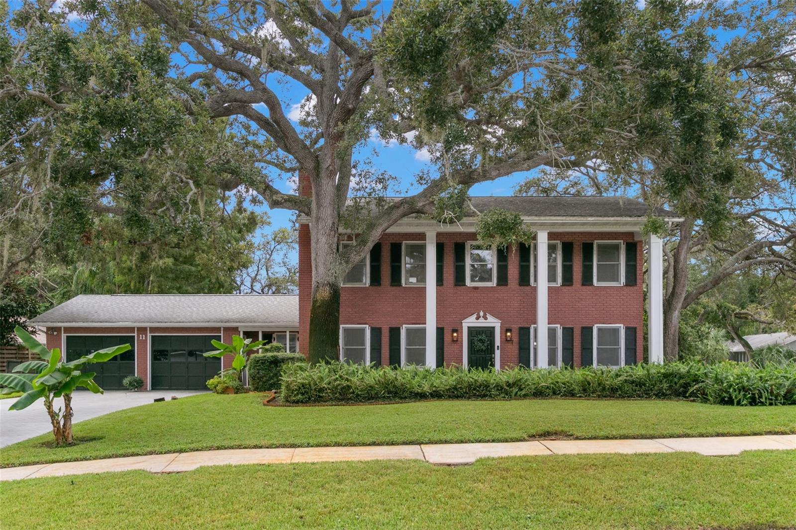 Welcome to this one-of-a-kind two-story Colonial home in desirable Safety Harbor! Situated on a prominent corner lot, this 3-bedroom, 3-bath beauty is full of character and thoughtful details. As they say, LOCATION, LOCATION, LOCATION! This home sits high in flood zone X, less than half a mile from Philippe Park. Walk, run, or bike to the park for beautiful sunrises and tree-canopied trails, or launch your kayak or boat from the public ramp.
Step inside to discover a spacious living room/formal dining room combo, as well as a family room with a cozy fireplace, ideal for gatherings or quiet evenings at home. The updated kitchen features a breakfast nook, coffee bar, and quartzite countertops. There is a full bathroom on this level that serves as a pool bath, as well as an indoor laundry room and a "bonus" room that provides extra storage or would make a perfect spot for a Peloton bike! Luxury vinyl plank flooring fills the home upstairs and down.
Head upstairs to find the three bedrooms, each with large closets. The master suite is a true retreat, featuring its own private fireplace for ultimate relaxation and a laundry chute to the first floor. The master bathroom was renovated in 2023 and includes dual sinks as well as dual shower heads in the spacious walk-in shower. The two additional bedrooms feature walk-in closets with windows, offering the potential for office or exercise space. The upstairs bathroom was also renovated in 2020.
Outside, your private oasis awaits: a large in-ground pool that stretches up to 8 feet deep—perfect for summer fun or serene floating under the stars. The oversized two-car garage provides ample space for vehicles, storage, or a workshop setup. A large shed provides additional storage, and a well for irrigation helps keep the water bill low.
This home offers timeless curb appeal with its Colonial facade, mature oak trees, and an unbeatable location on a quiet corner lot. Don't miss this rare opportunity to own a home that truly stands out from the rest!