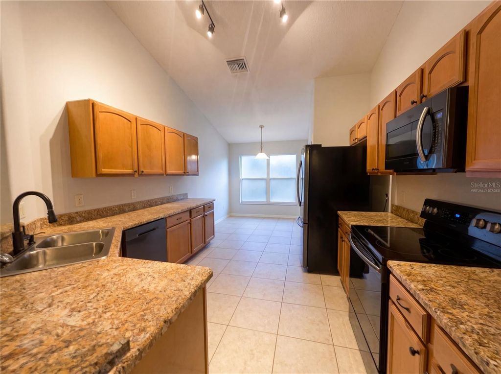 Photo of 1148 Greenley Avenue, Groveland, FL 34736 (MLS # O6390362)