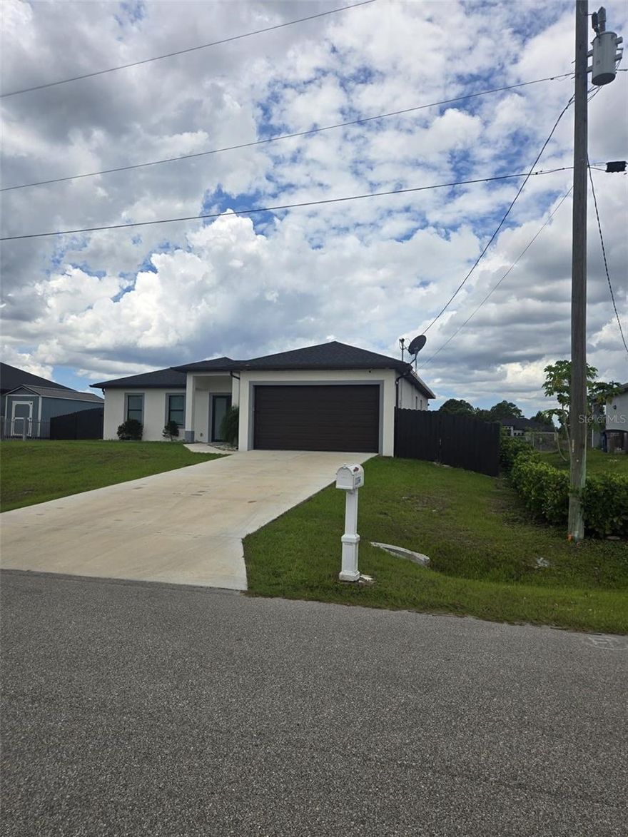 Beautiful home in Lehigh Acres with canal views! This 3-bedroom, 2-bath residence plus a versatile den features a bright open-concept layout, elegant polished tile flooring throughout, and hurricane-impact windows and doors. The modern kitchen includes stainless-steel appliances and stylish finishes, perfect for everyday living and entertaining. Enjoy a spacious 2-car garage and the added benefit of NO HOA fees. Conveniently located near parks, tennis courts, and walking/biking trails. A perfect place to call home!