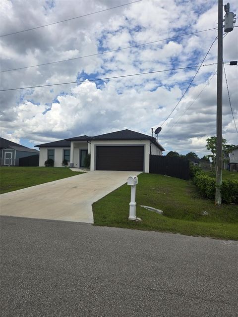 Photo of 1156 Helen Avenue S, Lehigh Acres, FL 33974 (MLS # S5148176)
