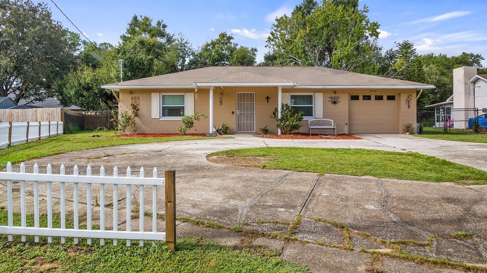 No HOA! Your Dream Home Awaits! Looking for the perfect place to settle down and create lasting memories? This MOVE-IN-READY 4-bedroom, 2-bathroom gem on a spacious 0.25-acre lot is just what you’ve been searching for. NEW ROOF TO BE INSTALLED BY THE END OF SEPTEMBER 2025. Pride of ownership shines throughout! As you enter, you’re greeted by a bright, airy living room with plenty of natural light. Featuring two spacious living areas, with an open floor plan, the kitchen features granite countertops, a breakfast bar, and stainless steel appliances, including a refrigerator, dishwasher, and range/oven. The owner's suite offers a private retreat with a generously sized walk-in closet and ensuite bathroom featuring a walk-in shower. The back bedroom is versatile, currently being used as an office. The family room is perfect for movie nights or relaxing, featuring a windowed wall that brings in serene views of your expansive backyard. NEW (10/24) Double-pane windows throughout the house. You'll love the added convenience of a tankless water heater, providing endless hot water for your family. The spacious living room is perfect for entertaining, flowing seamlessly into the dining and kitchen areas, creating an ideal space for gatherings. Step outside to the oversized fenced backyard, perfect for outdoor activities, or relax in the screened-in patio area—your go-to spot for cookouts, family celebrations, and weekend fun. Enjoy the convenience of a circular driveway making parking a breeze. Plus, you’re just minutes away from all the restaurants, exciting festivals and events in Eustis, Florida. Don't miss out on this one-of-a-kind opportunity to make this house your home! Please note that when using GPS to locate this property, it will take you in the wrong direction. Use this address: 2660 County Road 44 for your GPS.