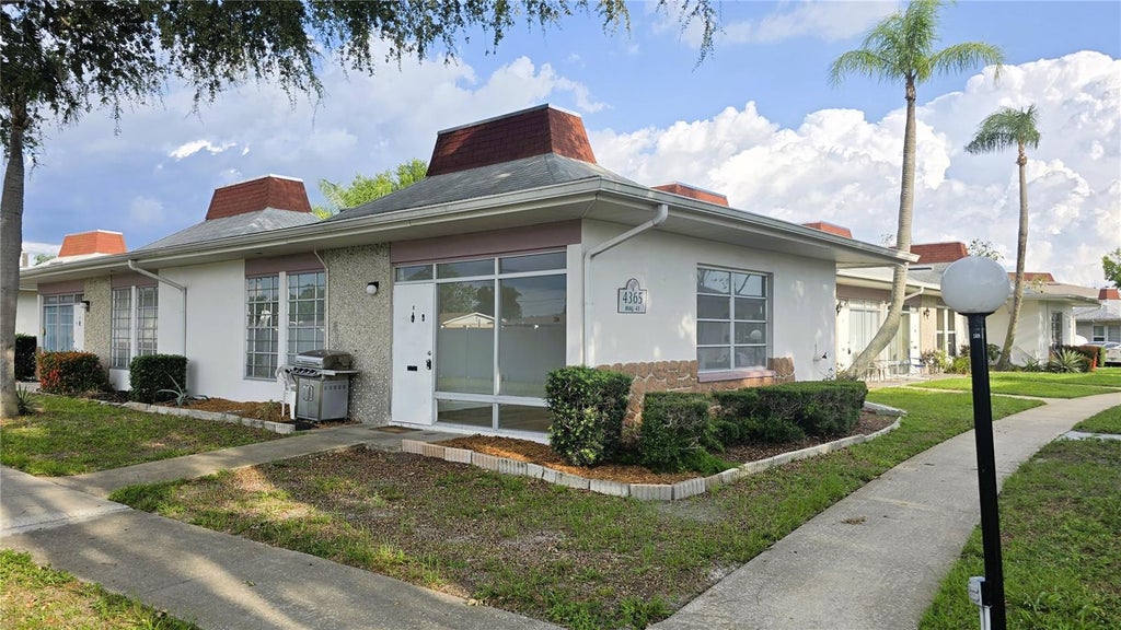 Photo of 4365 Tahitian Gardens Circle #E, Holiday, FL 34691 (MLS # TB8557631)