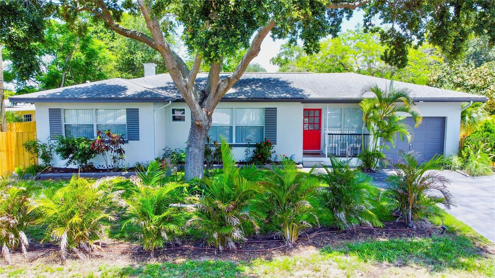 LIGHT, BRIGHT, PRETTY - Just Minutes from the Sugar Sand Beaches! Welcome to your little piece of paradise! This beautifully updated home is the perfect blend of coastal charm and modern convenience, located less than 10 minutes from the Gulf of Mexico beaches and breathtaking sunsets. INSIDE YOU'LL LOVE: Open-concept floor plan – perfect for entertaining. Very pretty Euro-style kitchen with quartz countertops, soft-close cabinetry, and stainless steel appliances. Durable deluxe vinyl flooring throughout. Primary king-sized en-suite with spacious cedar closet and gorgeous tiled walk-in shower. Two additional bedrooms with ample closet space and a fully tiled hall bath. Large bonus room with it's own split HVAC unit for personalized comfort (ideal as an office, den, or playroom) partitioned for privacy and peace. Interior laundry room (2024 full size W/D stackable included) with convenient side yard entrance for sandy feet, wet towels, and beach gear. OUTSIDE PERKS INCLUDE: Lush tropical landscaping and Areca palms with well water irrigation system (no water bill for you), Fully fenced yard – great for your doggie (sorry, no cats). Stepping stone and gravel open patio - solar shower (uses inside house water) – rinse off after a beach day. Screened garden paver patio – perfect for al fresco dining, and open paver patio 2 steps down from the kitchen for firing up the grill. Garage storage for bikes, beach toys, and more. LOCATION IS PERFECT: Less than 10 minutes to soft sandy beaches, and (NEVER FLOODED and NOT IN A FLOOD ZONE). Close to Largo Recreation Center, Central Park, Taylor Park, the Pinellas Trail, and golf courses, nearby shopping, dining, medical facilities, and top-rated schools. Easy access to Clearwater Beach (20 mins), downtown Dunedin & St. Pete (30 mins). SOME FURNISHINGS ARE INCLUDED - please see photo captions for details. Ready to live where others vacation? Grab your flip-flops and call me for your private showing today!