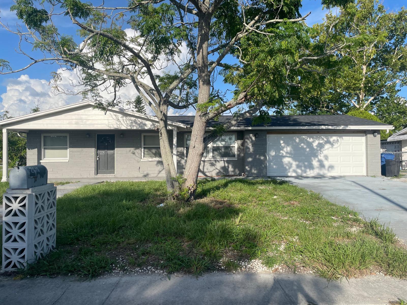 This size house is hard to find in this area, DO NOT WAIT. UPDATED 4 Bedroom 2 and a half Bath home in the a the great community of "Aloha Gardens". Great location to the popular Tarpon Springs Sponge Docks and close to All of North Pinellas County. This home has a spacious open kitchen, stainless steel appliances, higher end granite countertops and a large pantry PLUS a counter level eat in bar that looks into the great room and dining room. The master bedroom has a large closet and a private bathroom. Bathroom number 2 has a beautifully tiled open shower. This home has a lot of natural light. The 4th Bedroom or home office has a private entrance from the 1 car garage, The other 2 car garage has the half bath and laundry hook- up. Closet space is abundant.