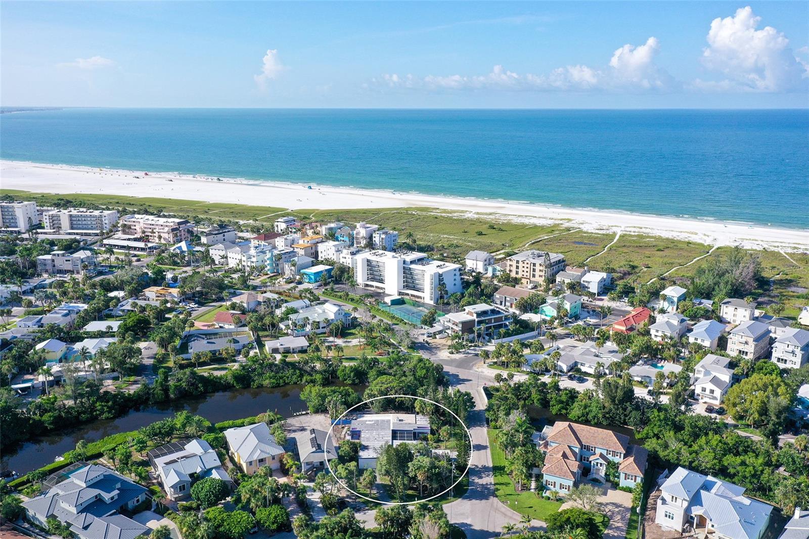 *2 BUILDABLE WATERFRONT LOTS* Palm Island IS the "Heart of Siesta Key". Don't miss this rare opportunity to live in Siesta Key's most sought-after neighborhood and experience the quiet, friendly, yet close to everything community of Palm Island. Build your tropical dream home on one lot and sell the other, or go "all in" and create your ideal island estate on the 17,883 sq ft lot. If restoration is more your style, this home was built using the Lamolithic poured in place construction method developed by John Lambie Jr and was a key design element in the Sarasota School of Architecture. As a result, most of the primary structure and walls are made of 12 inch poured concrete, providing unsurpassed strength and durability. This spacious property located in one of the finest and friendliest communities on Siesta Key is situated a mere 600 feet from arguably the best beach on the planet. Situated on the Grand Canal, it is minutes by boat to the Intercoastal Waterway and a short walk or bike ride to Siesta Key Village. This sought after Palm Island address sits on two county approved building lots and is a rare opportunity for all interests. Maximize your Island experience and treat yourself to this rare, peaceful island escape limited only by your imagination.