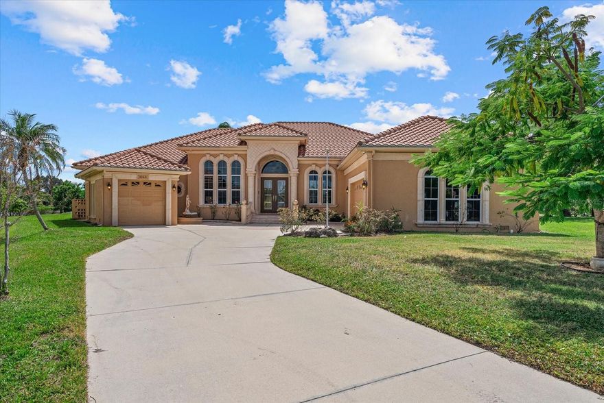 Welcome to your custom-built home in Cypress Creek Estates, a quiet and tranquil community tucked along the Manatee River in the heart of Bradenton. This sought-after neighborhood offers spacious lots, privacy, and the perfect setting to enjoy the Florida lifestyle. Designed and carefully built by the current owner, this home makes a lasting first impression. As you arrive, the long driveway guides you to a grand entryway. Step inside the double doors and you're greeted by soaring ceilings and a dramatic wall of glass that fills the home with natural light and open to the expansive screened lanai. Serene lake views set the stage for relaxed afternoons or lively gatherings. The large pool deck, sparkling pool, and fully equipped outdoor kitchen with grill and prep space make entertaining a joy. Inside, the thoughtful layout provides room for everyone with three spacious bedrooms, a dedicated office, and a versatile den/library. A split three-car garage flanks each side of the motor court, offering function and curb appeal. The chef's kitchen is a true highlight, complete with a wet bar, beverage cooler, and seamless connection to multiple living and dining areas that adapt to both formal entertaining and everyday comfort. From its inviting indoor spaces to its resort-style outdoor living, this home offers the perfect balance of elegance and ease. Welcome to your piece of Florida paradise. Reach out today for your private showing.