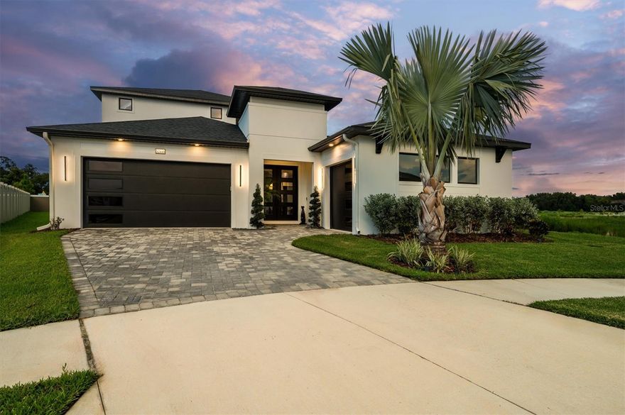 Significant price adjustment – motivated seller, priced to reflect current market. Located in Mirada’s exclusive Eagles Cove—home to the 15-acre crystal-clear lagoon with sandy beaches, swim-up bar, VIP areas, and paddle-course fun—this 5BR/4.5BA Biscayne Homes *Osprey 3 (Modern elevation)* offers understated elegance and true privacy on one of the community’s largest end-of-cul-de-sac lots bordered by protected wetlands. A south-facing courtyard pool with spa, cabana bath, and cathedral gabled screen enclosure captures all-day sun and unobstructed nature views. Inside, refined architecture meets smart-home utility with 10–11’ ceilings, tray accents, upgraded LED lighting, and warm muted finishes. The gourmet kitchen blends seamlessly into living spaces with a 10’ quartz waterfall island, concealed appliance storage, and built-in Fisher Paykel refrigeration. Solid concrete construction, hurricane-rated bronze windows, full warranties, app-controlled security, and a three-car epoxy-floored garage with 8’ doors assure lasting quality. Mature palms, rain-sensing irrigation, and color-matched pavers complete this rare offering for buyers who appreciate lasting craftsmanship, privacy, and effortless access to a resort-style lifestyle.