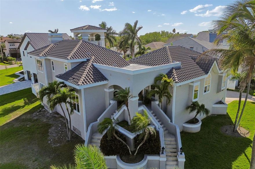 Experience refined coastal living at 816 Ponce De Leon Boulevard in the exclusive island community of Tierra Verde. This spacious, beautifully appointed multi-level residence offers an exceptional blend of elegance, comfort, and resort-style living.
The main living level is designed for both entertaining and comfortable everyday living, featuring formal living and dining rooms with French doors that open to multiple upper pool decks. At the heart of the home is a well-designed island kitchen with granite countertops, a generous breakfast bar, and a sunlit breakfast nook overlooking the pool. Just beyond, the inviting great room features custom-built-ins, a fireplace, a wet bar, and large sliding doors that provide seamless access to the outdoor living area.
The upper level serves as a private retreat, highlighted by a tranquil primary suite with an ensuite bath, private deck access, and an observatory tower with stunning sunset views. A den or private office, along with two additional bedrooms, provides flexibility for guests, family, or working from home. A conveniently tucked-away lower-level laundry area adds to the home’s thoughtful layout. An oversized 3- to 4-car garage offers abundant space for vehicles, golf carts, water toys, and additional storage.
Set within one of Pinellas County’s most sought-after waterfront communities, Tierra Verde is known for its upscale residential character, island ambiance, and unrivaled access to boating, world-class beaches, Fort De Soto Park, fine dining, and downtown St. Petersburg. This is a rare opportunity to own a distinctive home in one of Tampa Bay’s premier coastal enclaves.