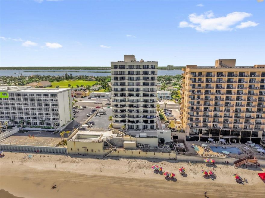 Experience true coastal living in this stunning direct oceanfront fully furnished condo located in beautiful Daytona Beach Shores. With a 7-day rental minimum, this home is not only an ideal vacation getaway but also a fantastic investment opportunity. Inside, you’ll find an open kitchen featuring stainless steel appliances, ample counter space, and a dedicated dining area. The spacious living room, enhanced with sleek porcelain tile floors, flows seamlessly to the oversized balcony where you can relax and enjoy sweeping ocean views. The primary suite offers dual closets, a walk-in shower in the private ensuite, and direct balcony access—perfect for taking in sunrise mornings over the water.  The guest bedroom and second full bath are equally inviting, with another walk-in shower and plenty of space for family or guests. A private laundry room with extra storage adds convenience. This residence is tastefully decorated with coastal-inspired furnishings, creating a move-in ready retreat. Recent updates include a brand-new Carrier 2-ton AC unit (2/25), ensuring year-round comfort. The building itself is undergoing multi-million-dollar renovations, including concrete restoration, fresh exterior paint, upgraded elevators, and new pool and sauna pavers—adding even more value for owners and guests alike. An assigned underground parking space provides additional peace of mind. This building has the LARGEST balconies in all of Daytona on the ocean! Whether you’re looking for a relaxing beachside escape or a strong rental investment, this oceanfront condo offers the best of both worlds.