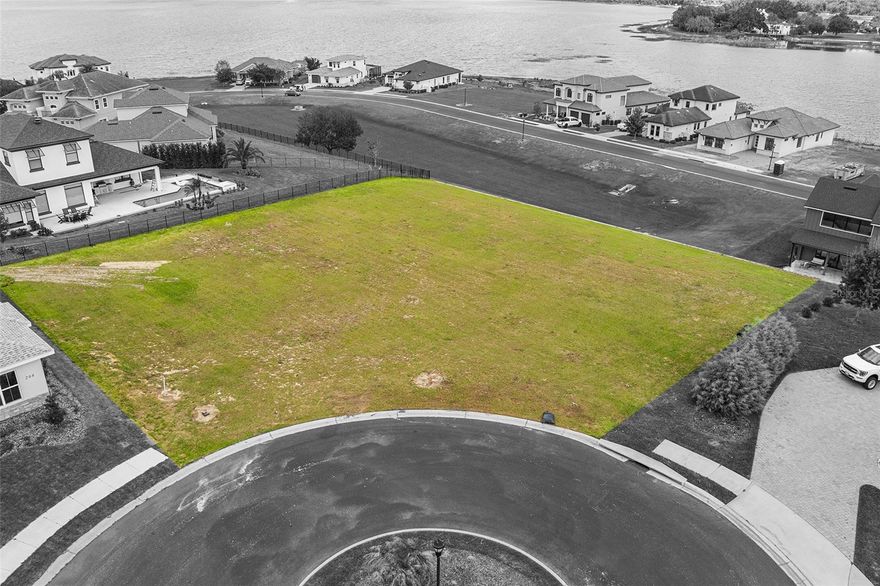 Oversized 0.31-acre buildable lot located in the gated custom home community of Water Ridge. Positioned on a cul-de-sac, this homesite offers lake views of Lake Alfred and features a larger lot width than many surrounding properties, providing flexibility for a variety of custom home designs and floorplans. The elevated setting allows for enhanced views of the surrounding lakes and natural scenery. Water Ridge is an established, upscale community known for its custom homes, well-maintained environment, and resort-style amenities.
Community amenities include multiple pools, clubhouses, fitness center, tennis courts, pickleball courts, basketball courts, fishing docks, boat ramps, lake access, and boat/RV storage. No CDD fees. Conveniently located with easy access to I-4, providing connectivity to Orlando, Tampa, shopping, dining, and Central Florida attractions.