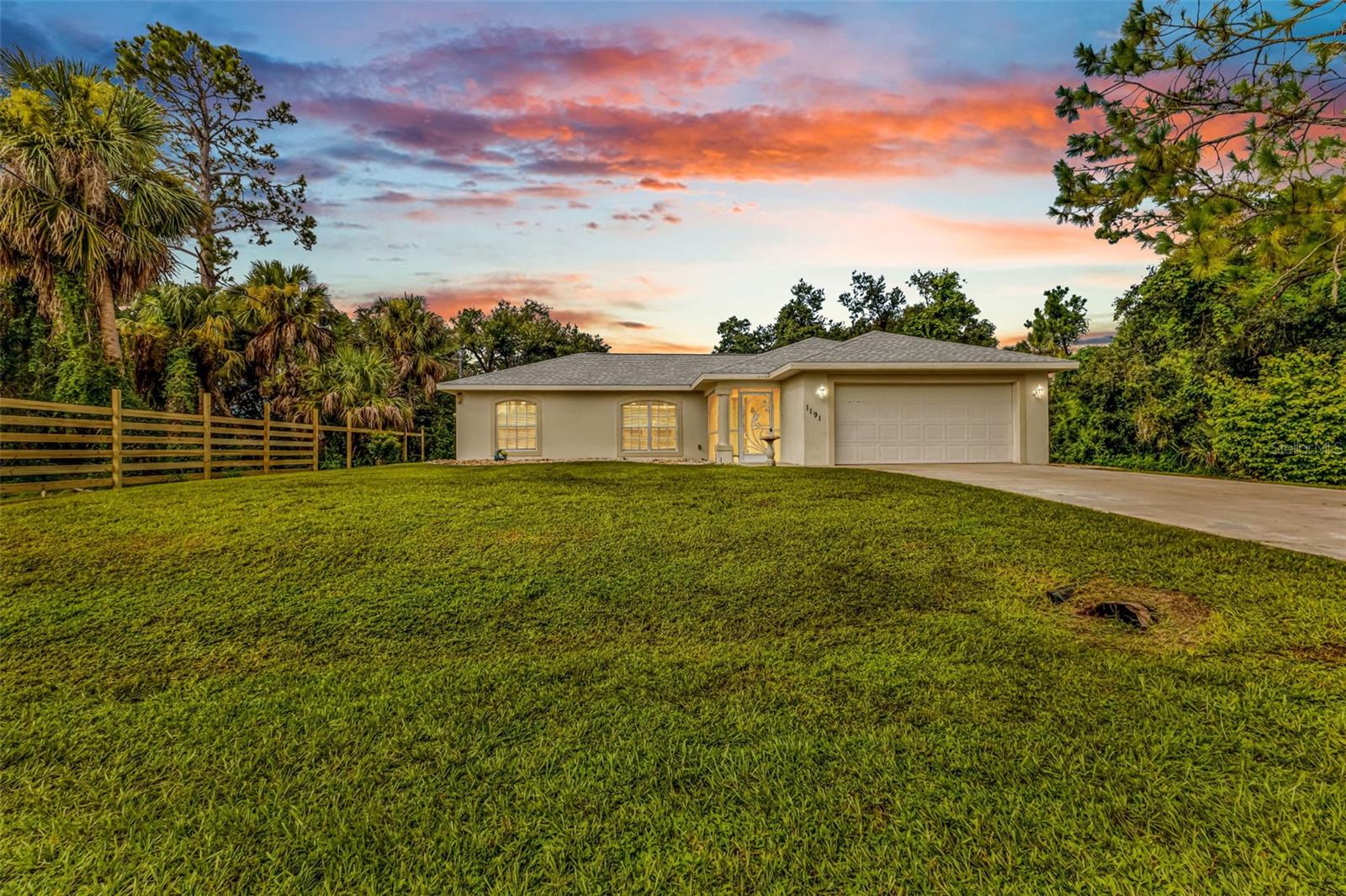 Welcome to 1191 Nebraska Ln, a three bedroom, two bathroom, two car garage home in the fast-growing and desired city of North Port in Sunny Southwest Florida! Here you will find a NEW ROOF in 2023 and a split-floorplan with just under 1300 square feet of living space with tile and laminate flooring throughout. Your main bedroom suite is on the right side of the home along with the laundry room and garage, your living room, dining room, and kitchen are located in the middle with access to the lanai through sliding glass doors, and the spare bedrooms and second bathroom are located on the left of the home, giving this home a convenient and often desired layout!
Make sure to check out the VIRTUAL TOUR and 3D FLOORPLAN to get a better look of this home before calling your favorite real estate agent to schedule a private tour of your own. Nebraska Ln is located in a nice area of North Port, “off Chamberlain Blvd”, which is conveniently located near US41 & I75, and very close to three different shopping centers including Price Crossing just about 2 miles away.
This home is perfect for first-time homebuyers, someone looking to buy a second home, vacation home, or even rental property! Cash, conventional, VA and FHA buyers are all welcome! Come see this cute and affordable home today!