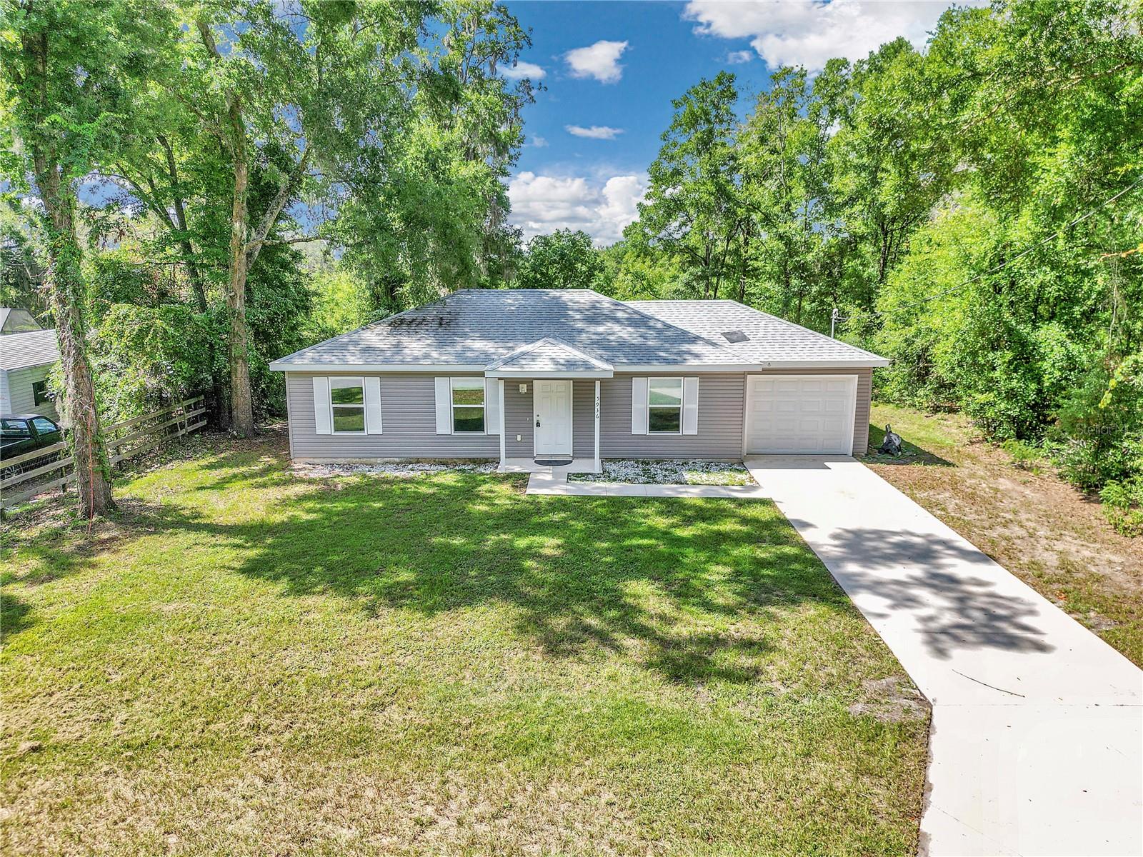 Beautifully maintained 3-bedroom, 2-bath home built in 2021, located just 10 minutes from the World Equestrian Center. This home features a 1-car garage and sits on an oversized lot with no neighbors behind or on one side, offering exceptional privacy. Surrounded by mature trees, the property provides a peaceful, nature-filled atmosphere while still being conveniently close to town. Perfect for equestrians, seasonal visitors, or anyone looking to enjoy the best of quiet living near WEC.