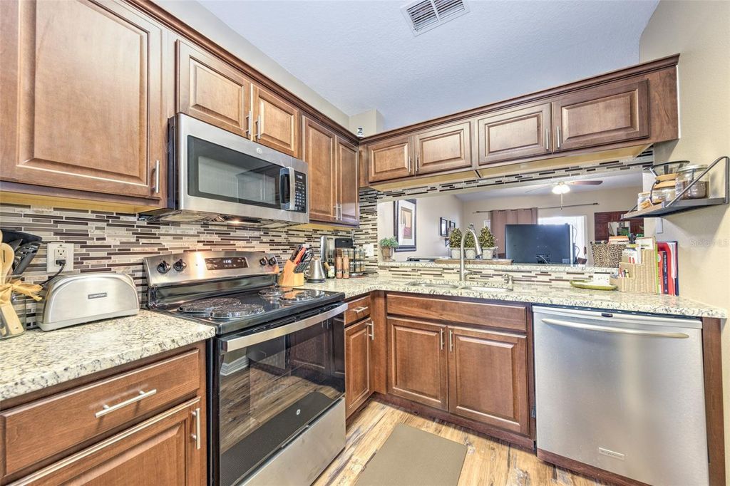 Photo of 30243 Lacledes Ln, Wesley Chapel, FL 33543 (MLS # TB8488586)