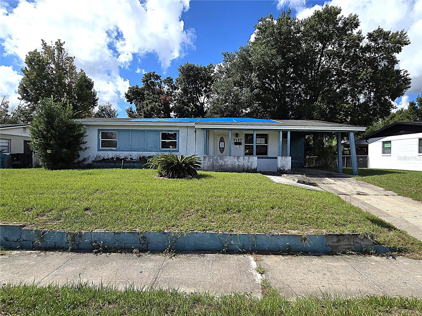 Multiple offers are in. All highest and best offers are due by 12 noon, 08/25/2025. Welcome to 3310 Wolcott PL, Orlando, FL 32805. This single-family block home is located in the Lake Mann Estates community. The residence features a three-bedroom, one-bathroom layout and a total living area of 936 square feet. The home includes a living room, dining room, and kitchen combo, along with a one-car carport and a front porch. The property is situated on a lot with a partial fence, providing a nice-sized yard for outdoor enjoyment. The community offers a public 260-acre lake for fishing and boating, along with nearby parks such as Gilbert McQueen Park and Roosevelt Martin Park, which have playgrounds, picnic areas, and walking trails. The property is also in close proximity to major roads like I-4 and the 408 East-West Expressway, as well as area attractions, shopping at The Florida Mall, and a variety of dining options. The assigned public schools for this community are Washington Shores Elementary, Carver Middle, and Jones High School. NO HOA to deal with! This property will not last long! Take a drive by today to see its potential for yourself.