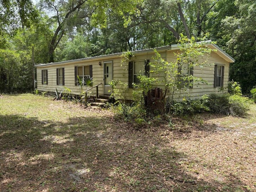 Nestled in the quiet countryside of Fort McCoy in Marion County, this 3-bedroom, 2-bath home offers an affordable opportunity to own nearly half an acre of land with no HOA and plenty of potential. Located just northeast of Ocala, the area is known for its open space, lakes, and proximity to the Ocala National Forest, making it ideal for those seeking a more private, rural lifestyle.

The home features 1,688 square feet of living space with a functional layout and solid core systems already in place. A new metal roof installed in 2023 provides peace of mind, while the plumbing, electrical, and septic systems are reported to be in good working condition. The property is serviced by a private well, a common and reliable setup for homes in the area, offering independence from monthly water bills.

Sitting on a 0.46-acre lot, there is plenty of room to enjoy outdoor living, store equipment, or create your own backyard setup. The covered lanai adds usable space for relaxing or entertaining.

This home will require some improvements, including HVAC ductwork and cosmetic updates, but presents a great opportunity for investors, cash buyers, or anyone looking to customize a property to their liking.

Whether you’re looking for a primary residence, rental, or weekend retreat, this property offers space, value, and potential in a growing area of Central Florida.