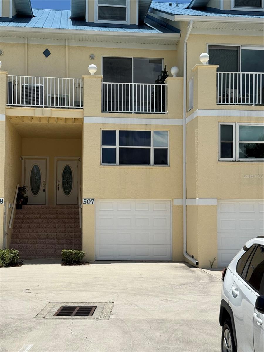 You would be hard pressed to find a better harbor view. Located with a full-on view of Charlotte Harbor and facing south with water views looking from east to west toward the setting sun, this 3-level townhome with a ground level single car garage— and also with its own separately deeded dock space—offers a rare opportunity to have both water view and access. Explore the Peace or Myakka rivers that both empty into Charlotte Harbor or head across the open water to Boca Grand Pass and the Gulf, all offering some of Florida’s best fishing. Oh, and there is plenty of room for freezers to keep your catch handy for your next fish fry! While in a part of Florida battered by recent hurricanes, this townhome is priced so that you can afford to bring your remodeling desires and skills to bear on a sound structure as many neighbors have already done. The gated community also has a pool and tennis courts and outdoor grilling areas.