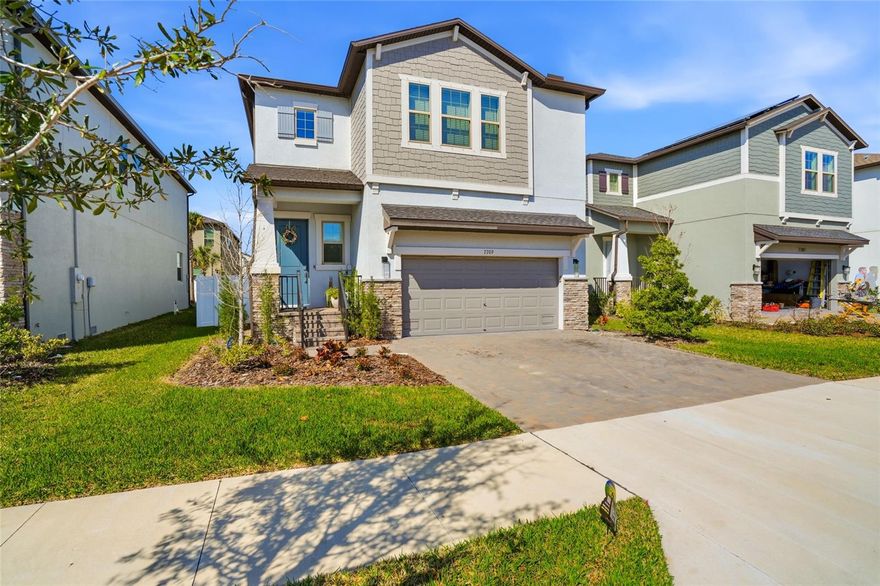 Built in 2023, this beautifully maintained four-bedroom, two-and-a-half-bath home offers modern style, thoughtful design, and a bright, airy feel throughout. Situated on a quiet, well-maintained street, the property features an attached two-car garage and a fully fenced backyard for added privacy.

As you step inside, you're welcomed by a dramatic foyer with soaring two-story ceilings that create an immediate sense of space and light. The main living area showcases large plank tile flooring, crown molding, and a neutral color palette that complements any style. Sliding glass doors open to a screened-in porch, creating a seamless indoor-outdoor living experience.

The kitchen is designed for both everyday living and entertaining, featuring white quartz countertops, a spacious island with seating, and a distinctive marble tile accent at the island base. A generous dining area sits just off the kitchen, along with additional seating at the island for casual meals.

All four bedrooms are located upstairs, along with a spacious loft that offers flexible living space for a media room, office, or play area. The primary suite features a large walk-in closet, double vanity, expansive shower, private water closet, and a linen closet for additional storage.

Convenience continues with an upstairs laundry room, and the washer and dryer will convey with the home.

Ideally located with easy access to MacDill Air Force Base, the Selmon Expressway, and Gandy Boulevard, this home is also just minutes from a wide variety of shops, dining, and everyday conveniences.

This move-in ready home combines modern construction, functional living space, and a prime location.