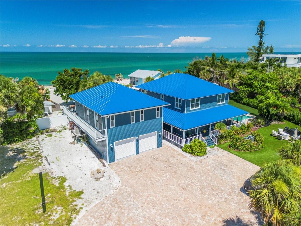 AN INCREDIBLY RARE, BEACH FRONT OPPORTUNITY on Manasota Key. One FULL acre of beach front property containing a wonderfully
remodeled home as well as a separate residence above the 2-car garage that’s perfect for a mother-in-law cottage, guest room for visitors or anAirBnB money maker. Dip your toes in the beach then rinse the sand off in your in-ground pool that sits next to one of the home's many covered porches and you can just soak up the southern charm. New floors throughout the downstairs, exude the sophistication and consistency of today’s decor. Clean lines and open spaces define this home. The kitchen, complete with cavernous pantry, butts up to a well-sized wet bar perfect for entertaining at any time of day. The primary bedroom makes you feel as if the rhythms of the Gulf of Mexico are singing you to sleep. In fact, best-in-class views await you outside nearly every window. Stepping into your view is as simple as stepping into the Gulf of Mexico, which is right outside your door. Step outside your front door and when you've finished admiring your new metal roof you can sink a few putts on your own private putting green or walk a few steps further to discover your deeded access to the bay side of the island. Bring your canoe, paddleboard, or kayak and let the adventures begin. The home is situated close enough to the bridge to the mainland to allow easy entrance and exit from the island. Yet 8400 Manasota Key still lies far enough south to make sure you enjoy the privacy and quiet the island is known for. All of these perks and pleasures come at a price unheard of for a property offering all of this and one full acre of land. The future possibilities are endless.