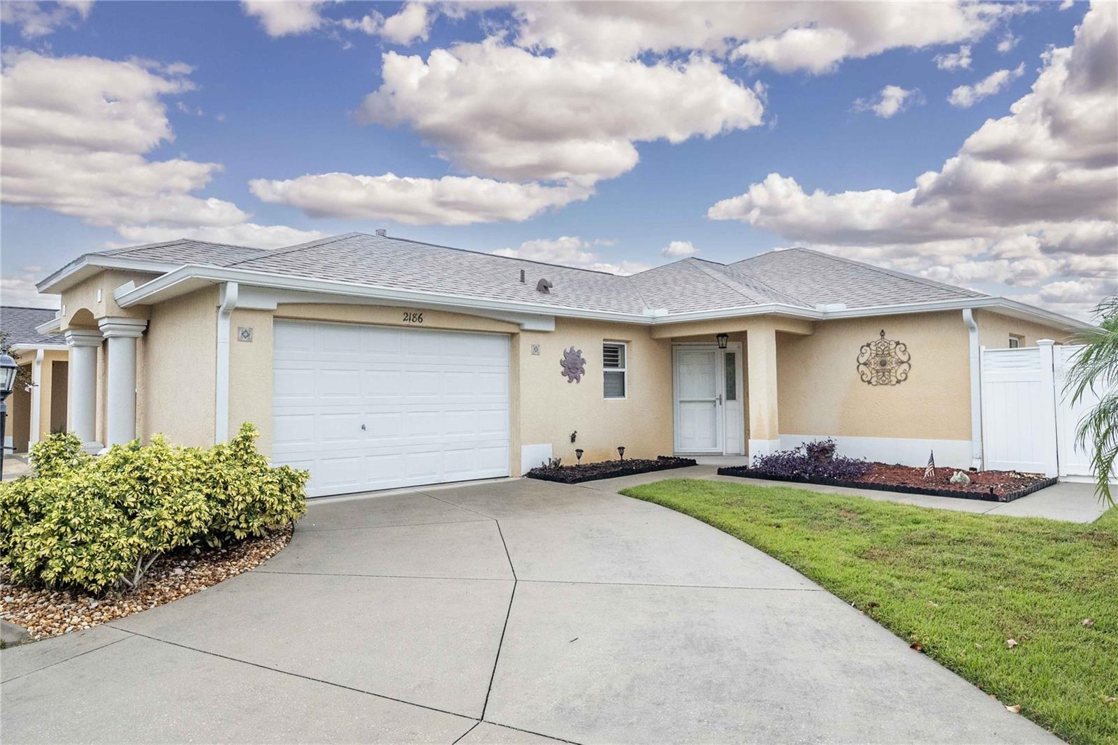 AVAILABLE Sept 1! If you're ready to embrace the quintessential Florida lifestyle, look no further than this inviting 3-bedroom, 2-bathroom corner lot Courtyard Villa in the highly sought-after Village of Tall Trees. This Villa offers immediate access to the pleasures of Florida living. The location couldn't be more ideal, with convenient proximity to shopping, grocery stores and an array of restaurants along CR 466. This welcoming villa boasts more than 1,600 square feet of living space, characterized by voluminous ceilings, chic laminate plank and 18" tile flooring, and modern stainless steel appliances. The master bedroom is a serene sanctuary, complete with its own en-suite featuring a double vanity, seperate shower, and a solar tube that bathes the space in the warmth of natural sunlight. Plus, there's a roomy walk-in closet for your convenience. The other two bedrooms are thoughtfully designed, sharing a well-appointed full bath with a tub/shower combination. Enhancing your living experience is an oversized backyard, plantation shutters, a charming breakfast nook, a screened lanai with shades, and an open patio that's perfect for savoring your sun-filled mornings. The amenities of The Villages await your enjoyment. Whether you're seeking a winter escape or an extended stay, this Courtyard Villa in the Village of Tall Trees is the perfect setting for your Florida Adventure. Contact us for precise pricing details, and take the first step toward your journey today.