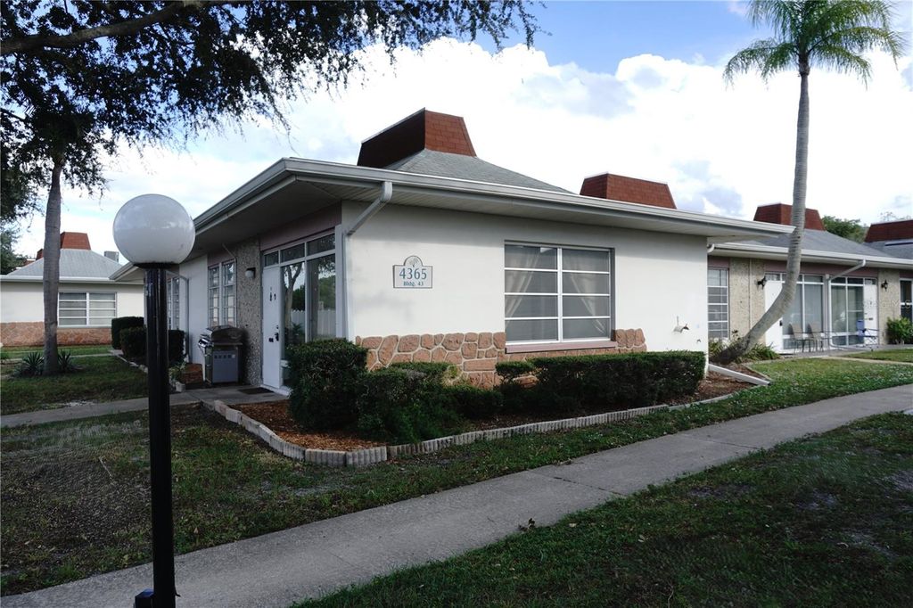 Photo of 4365 Tahitian Gardens Circle #E, Holiday, FL 34691 (MLS # TB8434737)