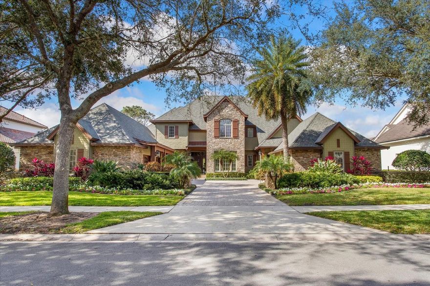 Keene's Pointe - 24 hour gated/attended community. Situated on the 18th fairway of The Golden Bear Club, an 18-hole course designed by Jack Nicklaus featuring golf, tennis, fitness, dining and swimming. This 6 bedroom/5 bath home has unmatched custom detailing and features inside and out. Upon entering you are greeted by the grand two-story entry that drives your attention through a wall of rear glass with expansive golf views. The formal dining and sitting areas flank each side of the entry. The massive two-story family room opens perfectly to the kitchen fully equipped with high end appliances, custom cabinets, an informal dining area and wet bar. There is a private screened dining porch off of the kitchen area with tongue and groove ceiling, custom wood details and lighting. Distressed hand-scraped hardwood floors and a wood and iron staircase with a balcony overlooking the family room, and a two-sided stone gas fireplace complete the gathering areas. The home office is incredibly finished with custom cabinetry, wall paneling, adjoining bath, and golf views. The primary suite is spacious and offers a vaulted ceiling with tongue-and-groove wood and new herringbone wood flooring. There are two spacious closets and a spacious primary bath with jetted tub and two vanities. There is also a guest bedroom on the first floor with bath, second office and large laundry room with cabinetry, perfect for pets and multiple washer/dryers.  Upstairs you will find three additional bedrooms, two baths, and library overlooking the great room.  The sixth bedroom can also serve as a bonus/game room and has a large room for storage. Outdoors you will enjoy the massive covered lanai with fireplace and summer kitchen overlooking the pool and spa, and of course the 18th green with beautiful sunsets and Disney fireworks!  There are 2 two-car garages, one is finished with AC and a golf cart garage and can be used as an additional bonus/game room. Close to top-rated public and private schools, shopping, dining, expressways and major tourist attractions, this home has so many exquisite features that make it a must see!