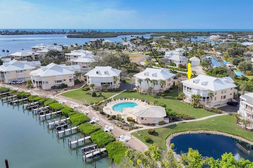 Top floor, end unit 3 bedroom, 3 bath, 2,085sf in the gated resort community of Placida Harbour!  Beautifully renovated with a redesigned kitchen including a large island, granite counters, an induction stove, and extra storage added with a wall of new cabinetry. The dining area has a wet bar with a wine refrigerator, and a large bay window! The cathedral ceiling in the living and dining areas allow the natural light to fill the space! New ceramic tile flooring throughout all living spaces.  Sliders from the living and master bedroom open to a screened lanai overlooking the newly renovated marina and the ICW!  The master and a guest bedroom are located on the main living level with the 3rd bedroom and bath on the second level. Great for guests or as a den or office. The 3 baths were also renovated with new tiles showers and additional custom cabinetry. Placida Harbour amenities include a gated entry, walking trails, 3 pools, a clubhouse, and tennis / pickleball courts, plus a ferry to a private beach.  In addition, a new Marina is being completed with slips available first come first serve!