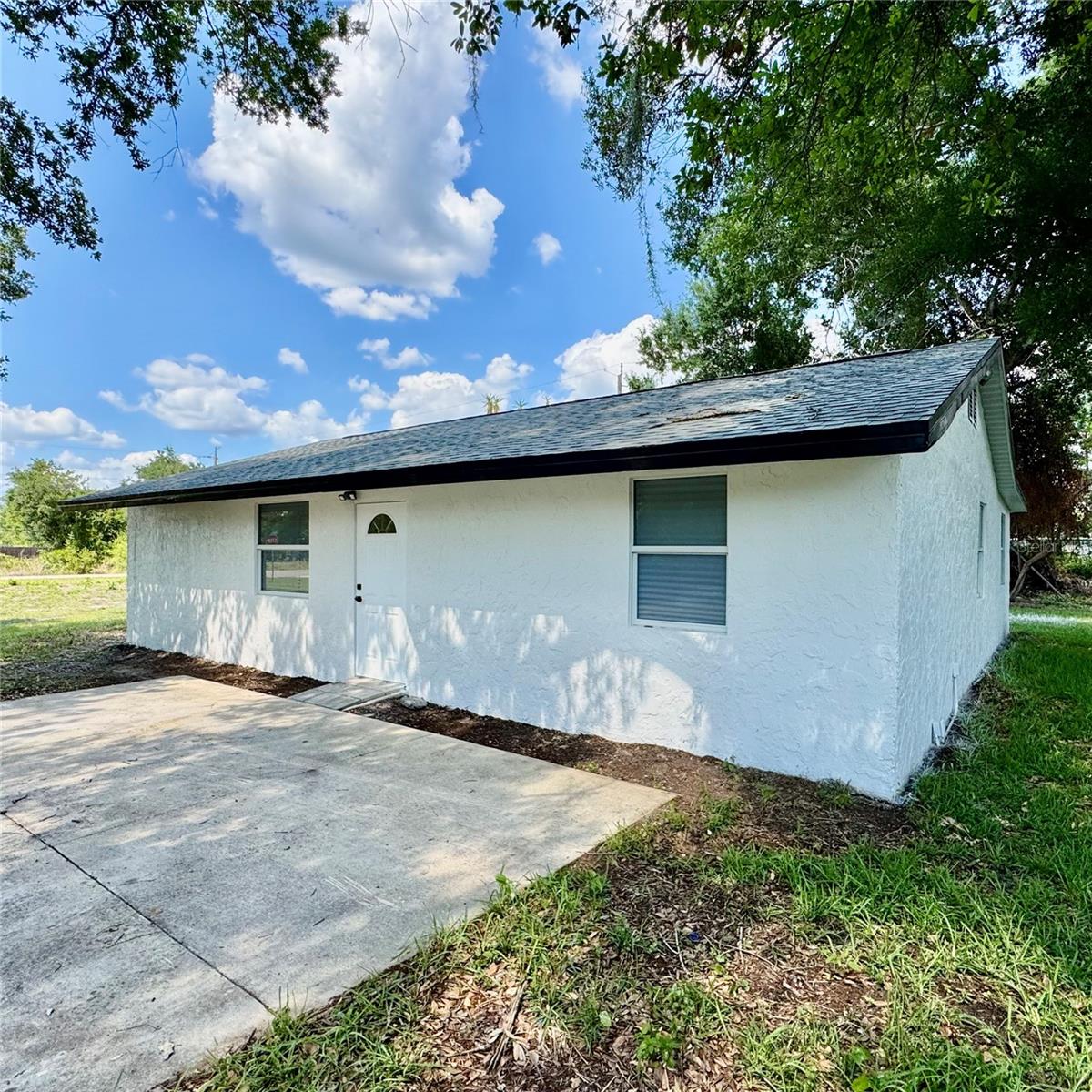 Stunning fully renovated 5 bed, 2 bath home on a 10,000 sq ft lot. Brand new roof (2024), new plumbing, electrical, and lighting throughout. A/C recently serviced for peace of mind. Features elegant porcelain floors, open concept layout, and modern kitchen with new appliances. Includes new washer and dryer. All closets are custom-built. Offers a large in-law suite or spacious master bedroom. Sleek bathrooms and thoughtful upgrades throughout. Perfect for boat enthusiasts—near ocean access with ample space to park a boat or trailer. A true move-in ready gem!