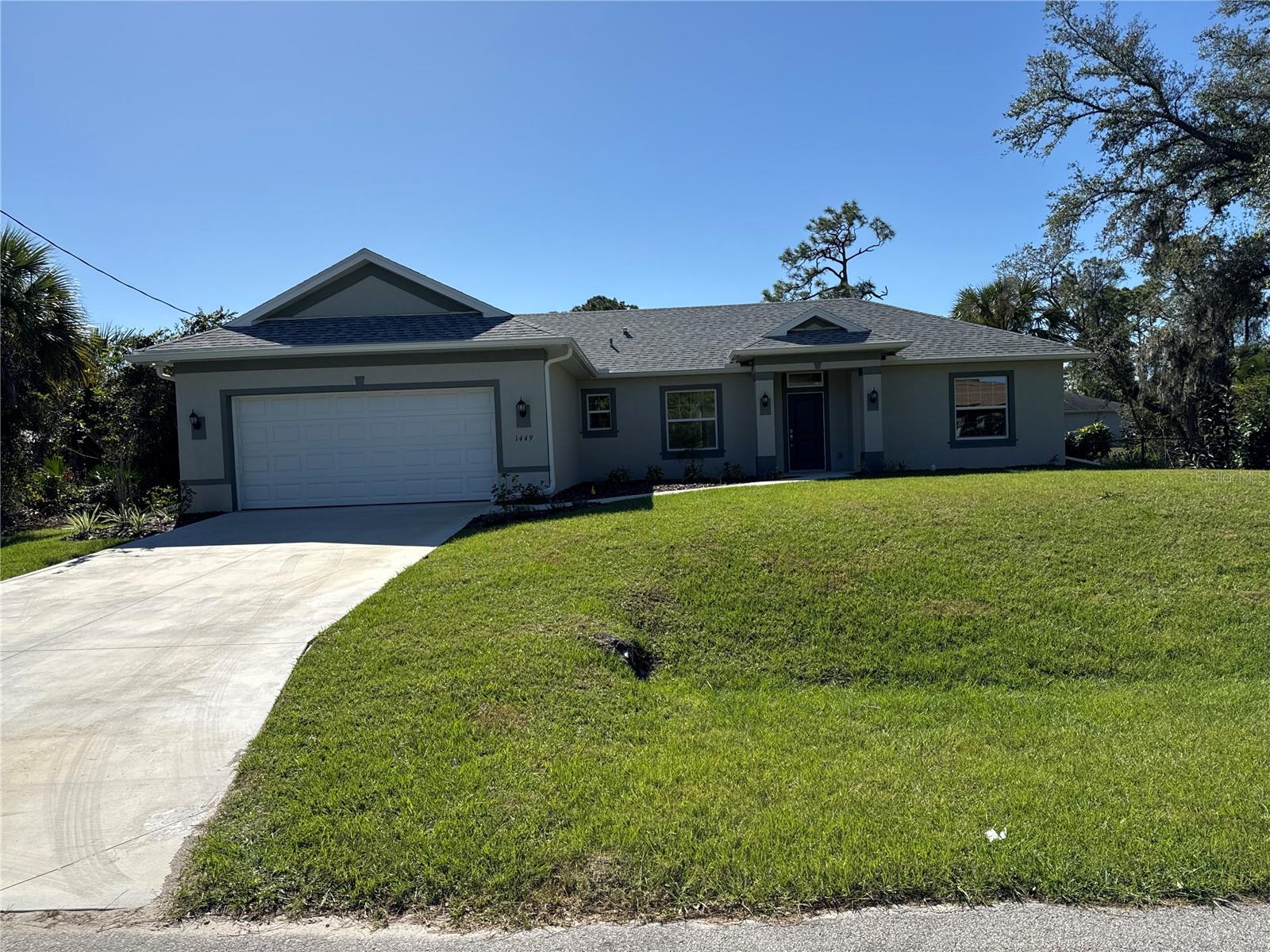 PRICE REDUCED!! New construction. Move in ready. This 3 bedroom home has spacious rooms with an open/split floor plan. Kitchen has a granite countertop and breakfast bar which compliments the kitchen. Great room is in combination with the kitchen as an open concept. There are sliding glass doors from the great room which leads to porch. The split bedroom plan has a primary bedroom which features a walk in closet, walk in shower, double sinks and a garden bathtub. 2 other bedrooms with central hallway. The home has a separate laundry room with a granite countertop perfect for folding laundry and cabinet space situated between the kitchen and 2 car garage.
