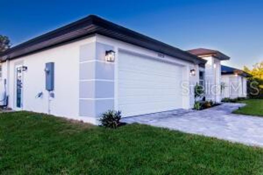 Photo of 10654 Washington Road, Port Charlotte, FL 33981 (MLS # O6354150)